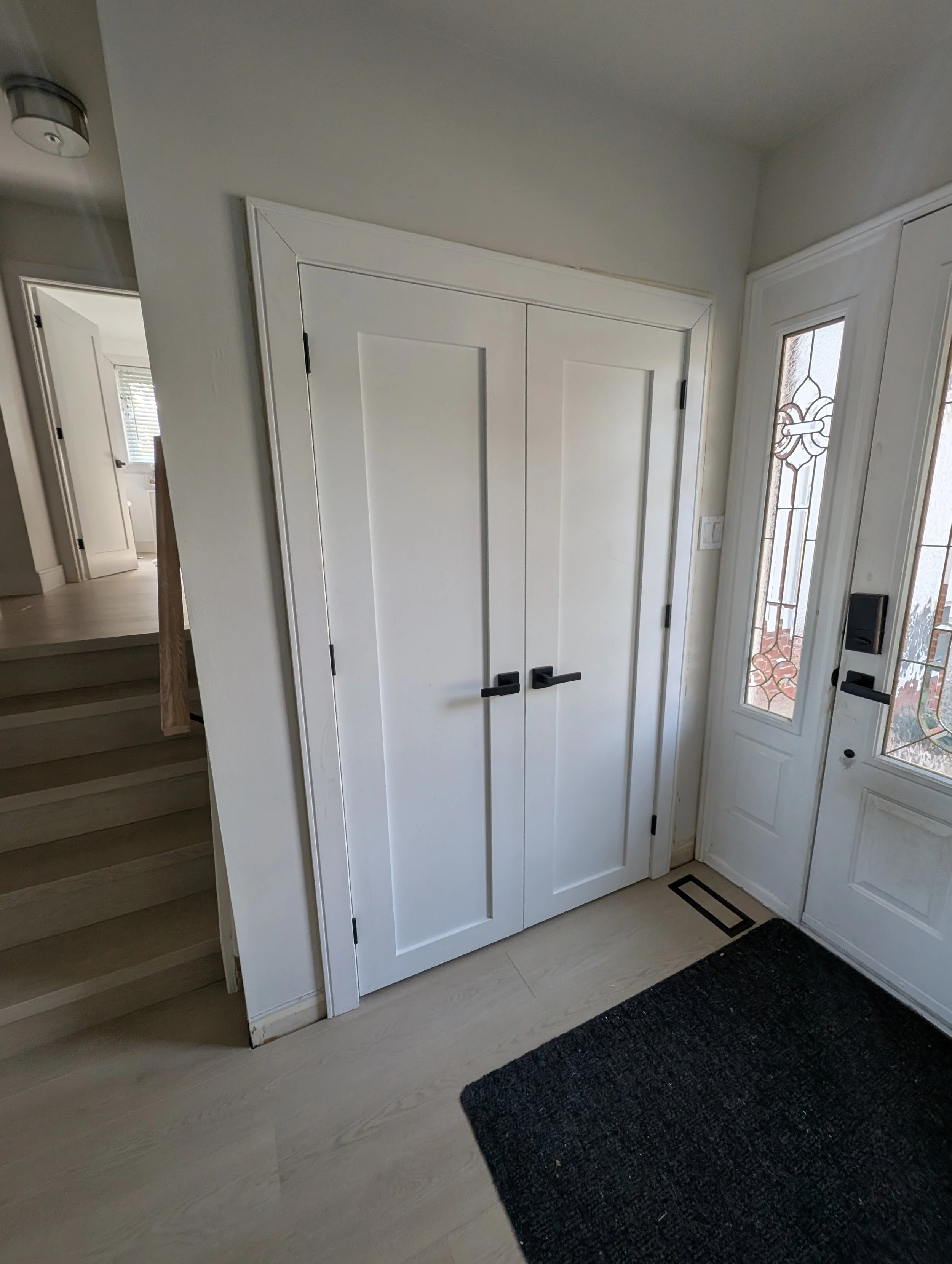 Double closet door in the entry way of a Burlington home
