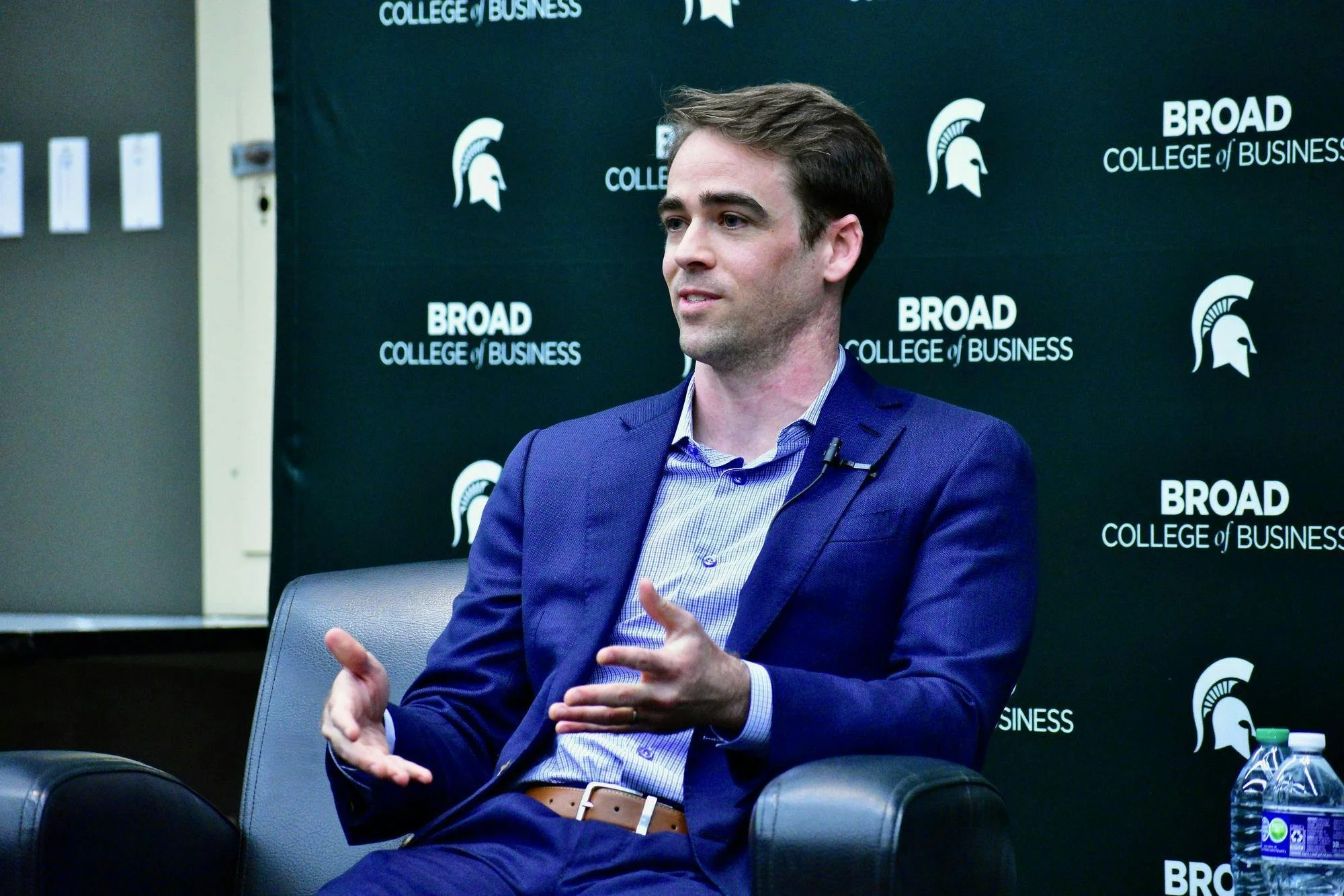 Tyler at Michigan State Sitting in Suit