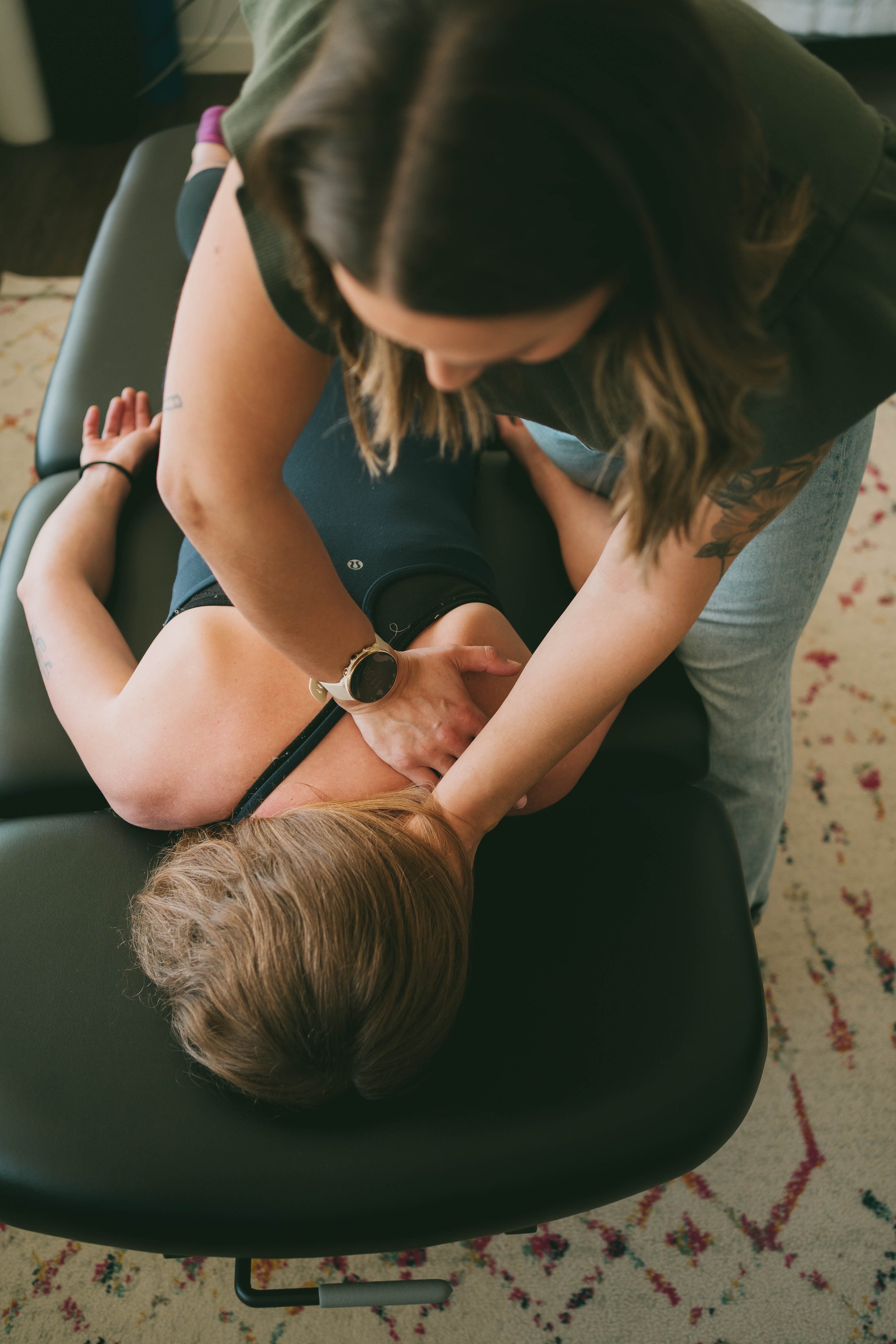 A close up of a chiropractor performing mobilizations in a person mid back