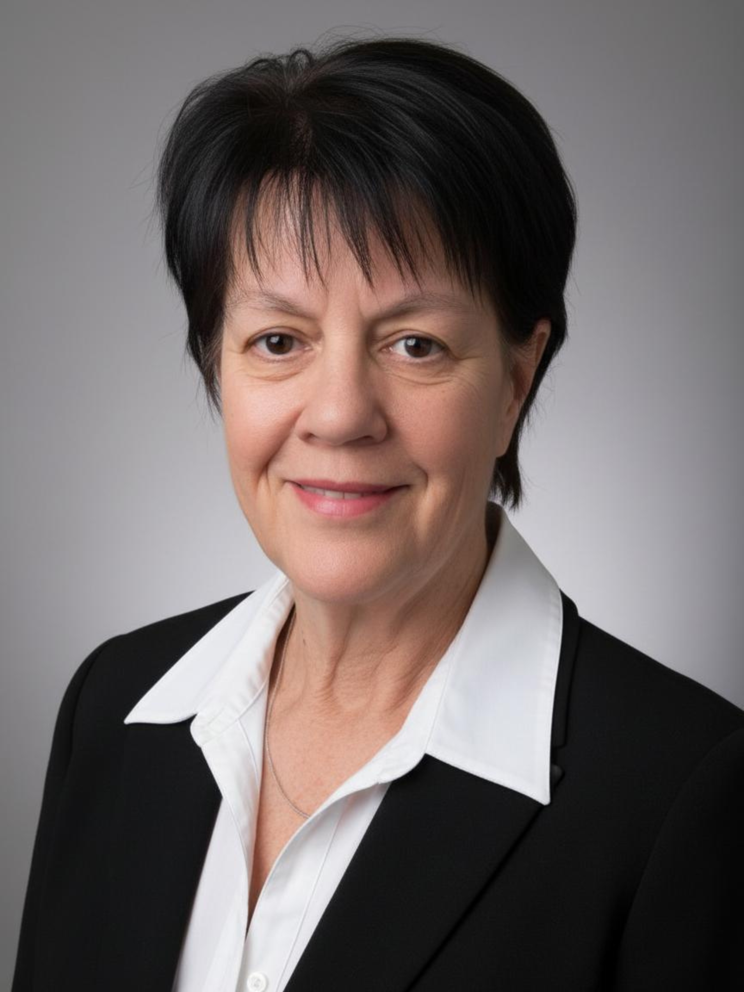 Professional headshot of Patricia, an experienced therapist known for her compassionate, grounded approach to helping individuals heal from trauma, grief, and loss.