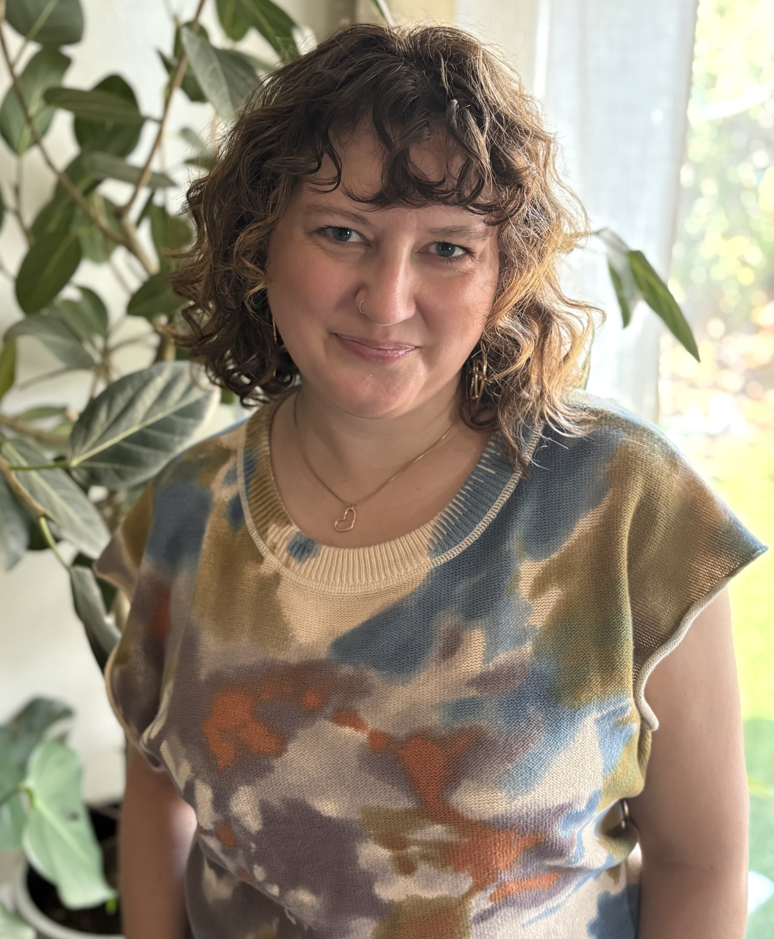 Brianne, Licensed Professional Counselor, pictured in a professional headshot with a friendly, calm demeanor.