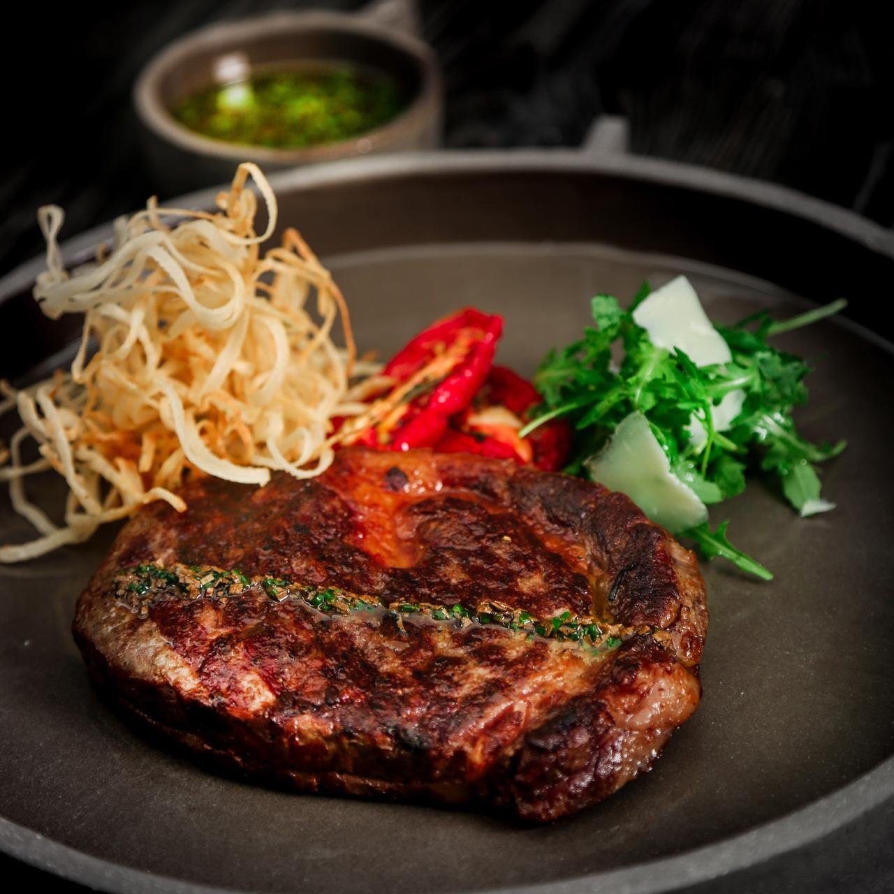 Grilled Ribeye Steak with Crispy Roots