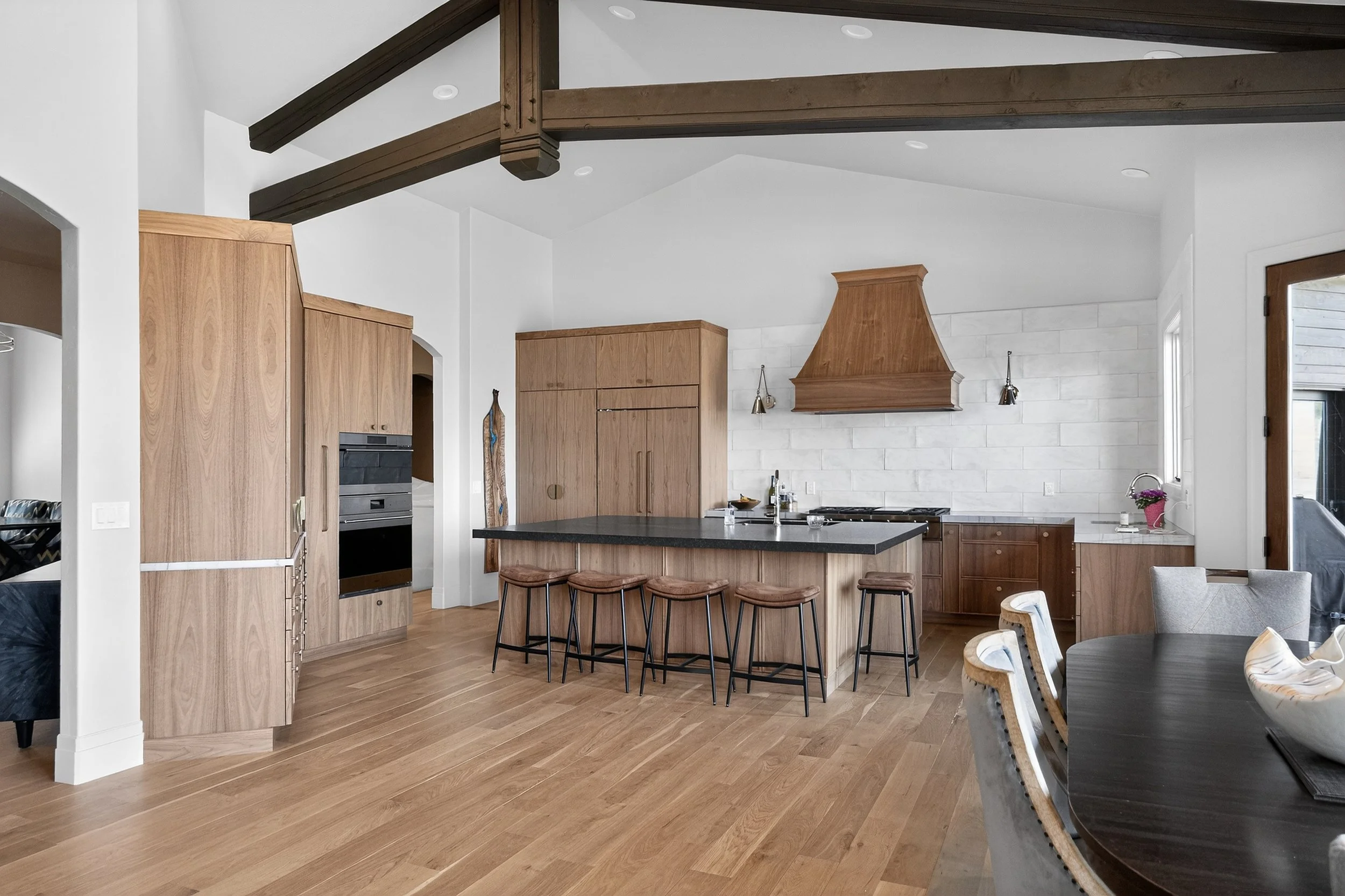 New cabinetry, flooring, countertops, lighting and range hood
