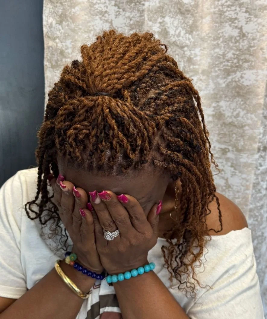 Salon customer with new long natural braids