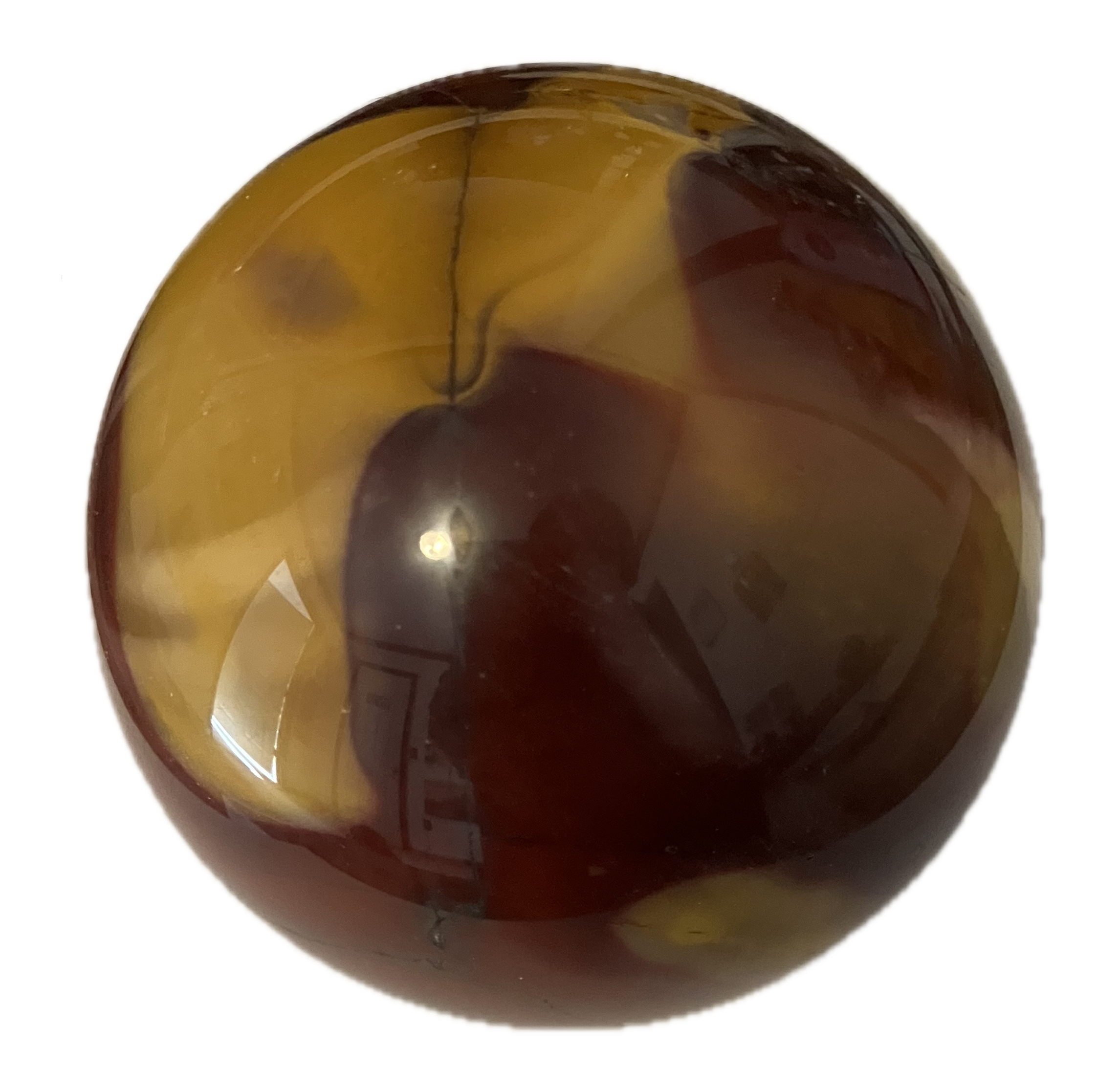 Close-up of a polished crystal stone with swirling yellow and dark red colors.