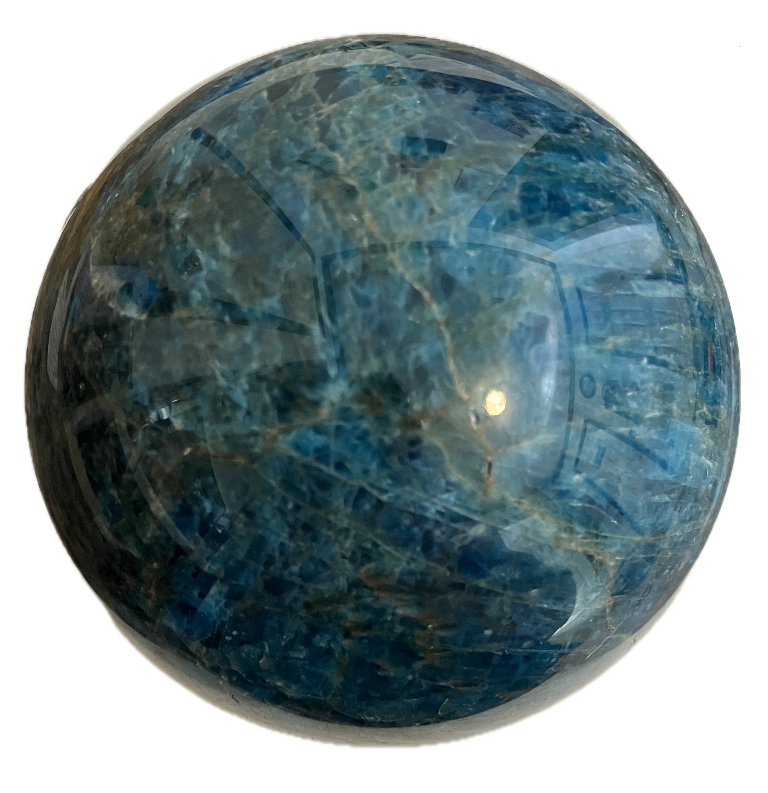 A crystal stone sphere with a blue-green interior pattern, reflecting light and showing intricate textures inside.