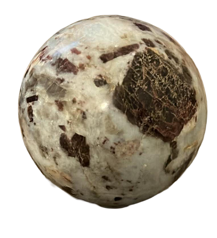A spherical polished crystal stone with a marbled pattern in white, black, and brown colors.