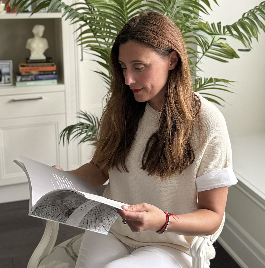 Founder Elena Iacono reading a LegacyNex Human Inheritance Collection