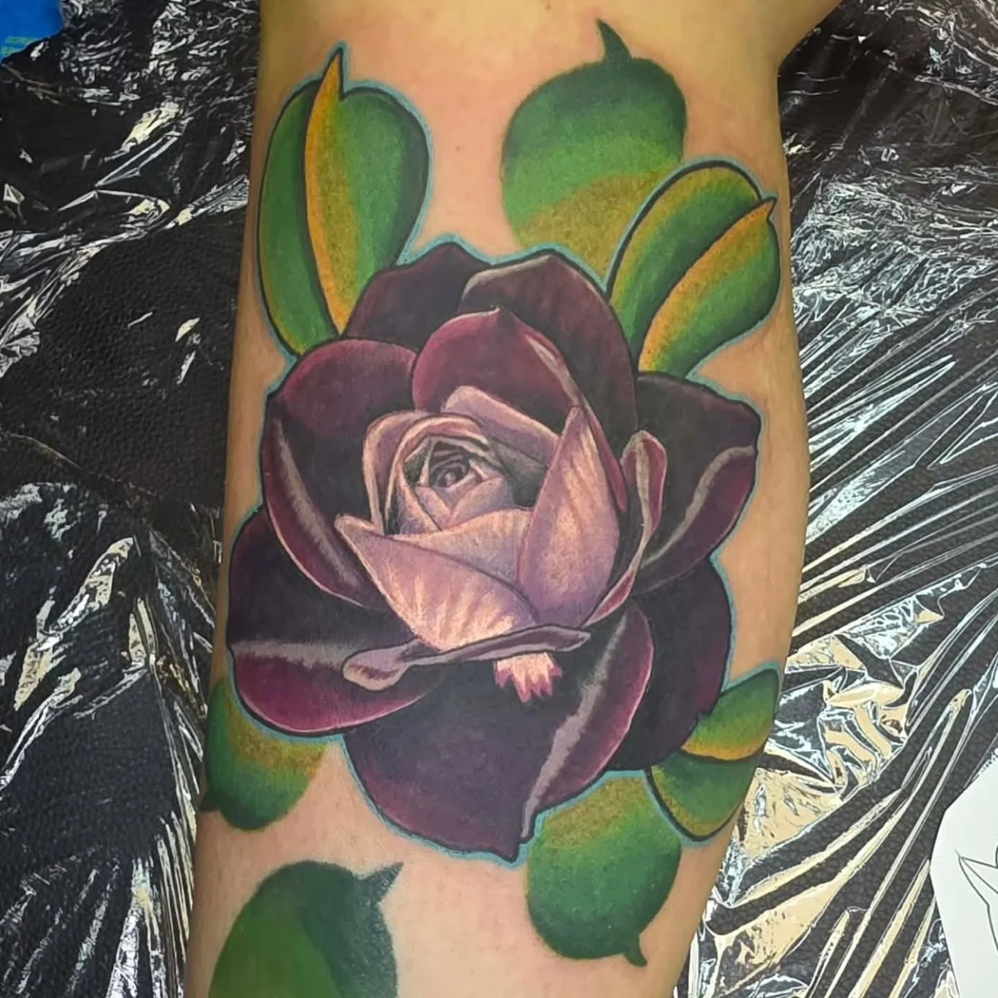 Justin added another Neo Traditional rose onto Caras growing leg sleeve.