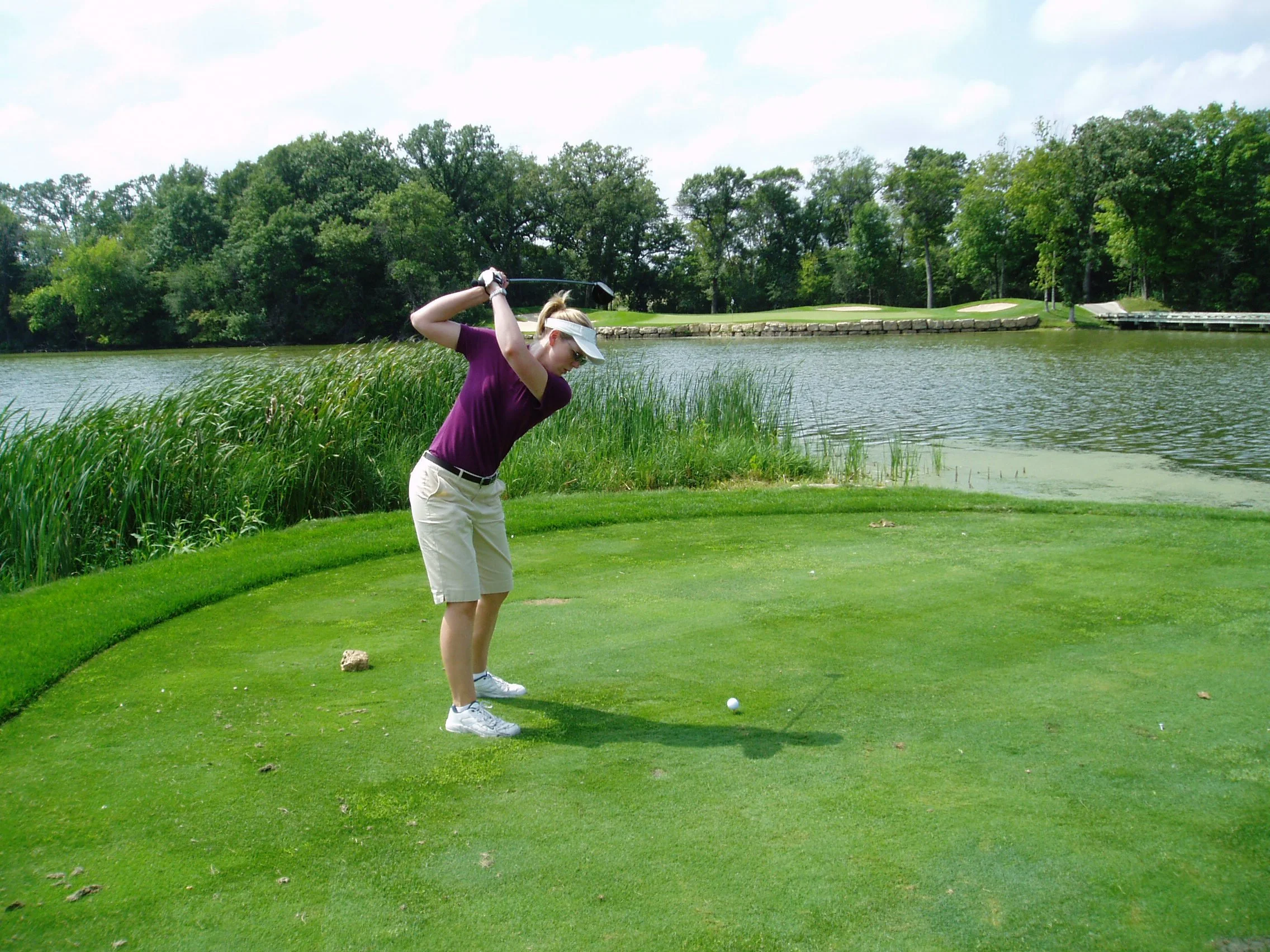 Golfer practicing a swing on a course, illustrating skill development through repetition