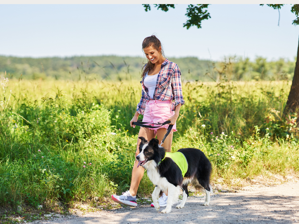Woman outdoors stretching and smiling, representing balance and mental wellness after therapy