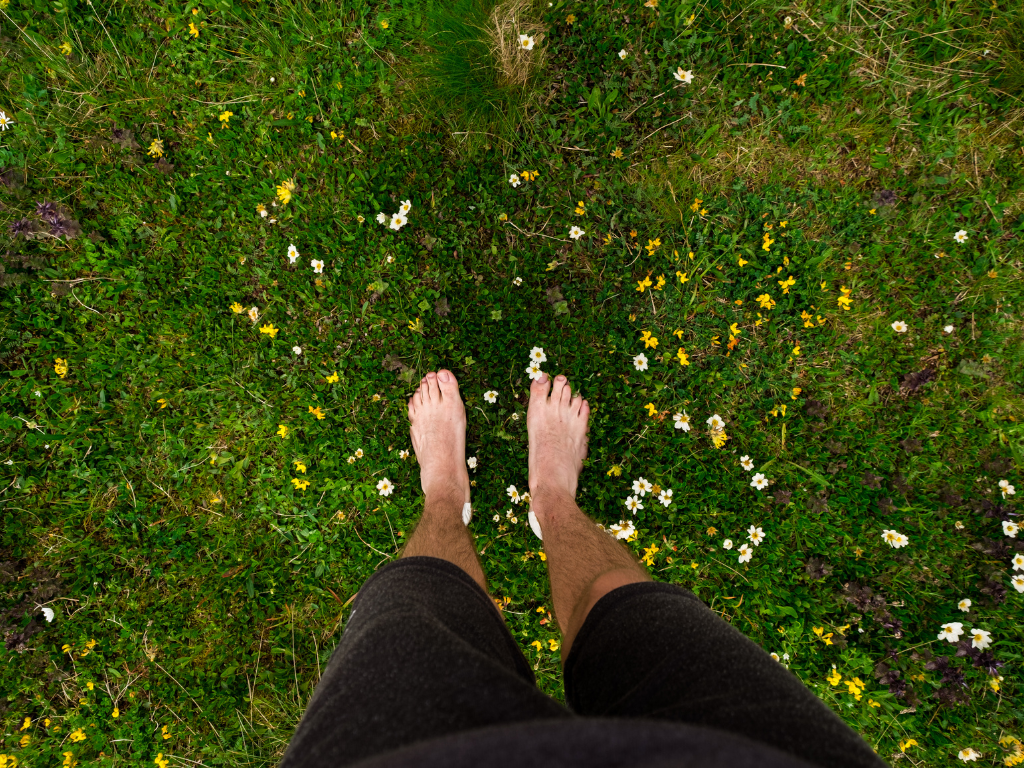 A woman using grounding techniques during a moment of stress, anxiety, and emotional overwhelm