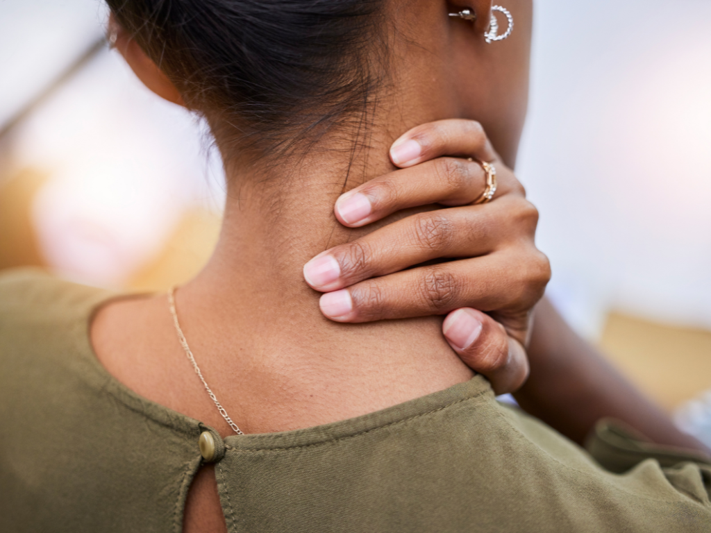Woman noticing tension in her body after saying no to a request
