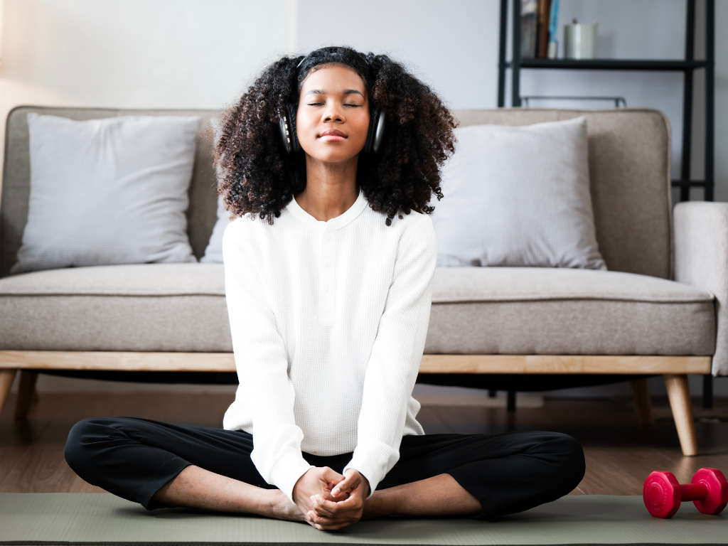 Black woman participating in a therapy session focused on reducing anxiety, burnout, and chronic stress.