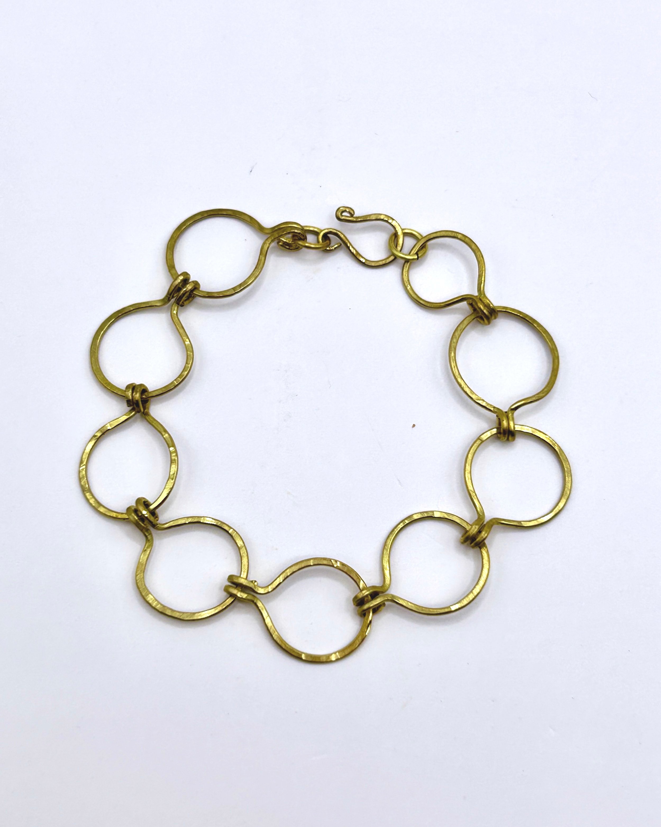 Caroline Open Circles Bracelet in Jeweler's Brass on metal block