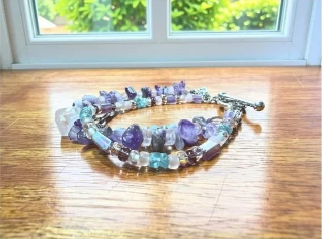 Amethyst & Rose Quartz Multi-Strand Bracelet on wood