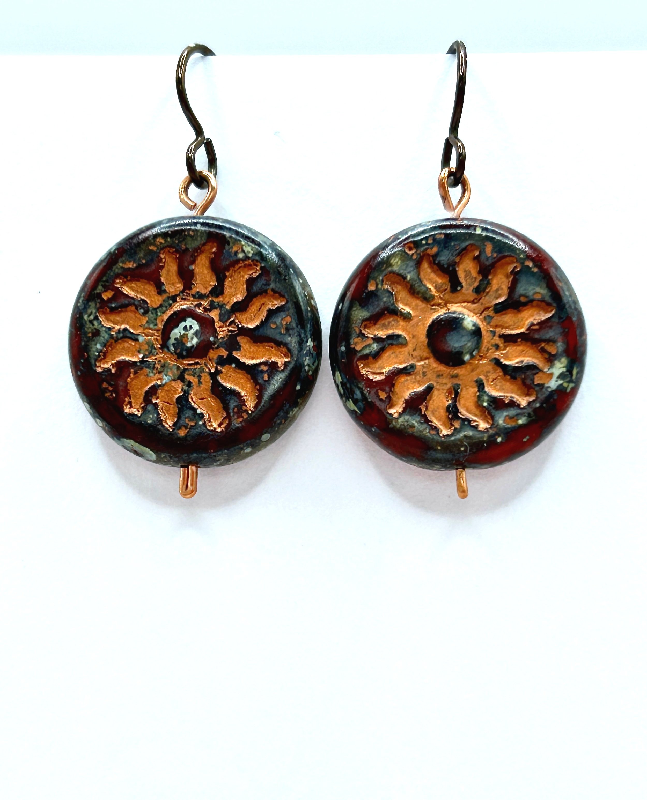 Winter Sol Deep Burgundy and Copper Starburst Czech Glass Coin short drop earrings with copper metal french ear wires on white background