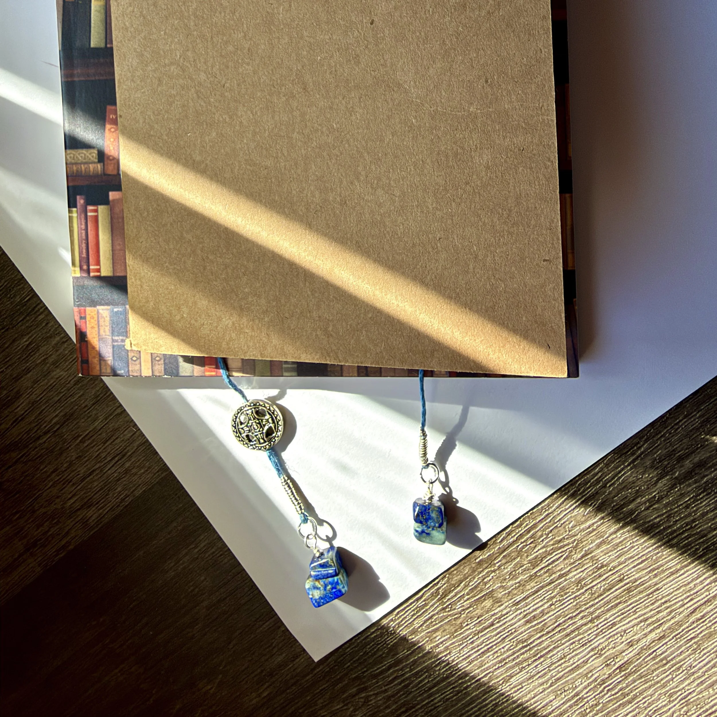 Denim blue hemp cord and lapis lazuli bookmark with silver accents