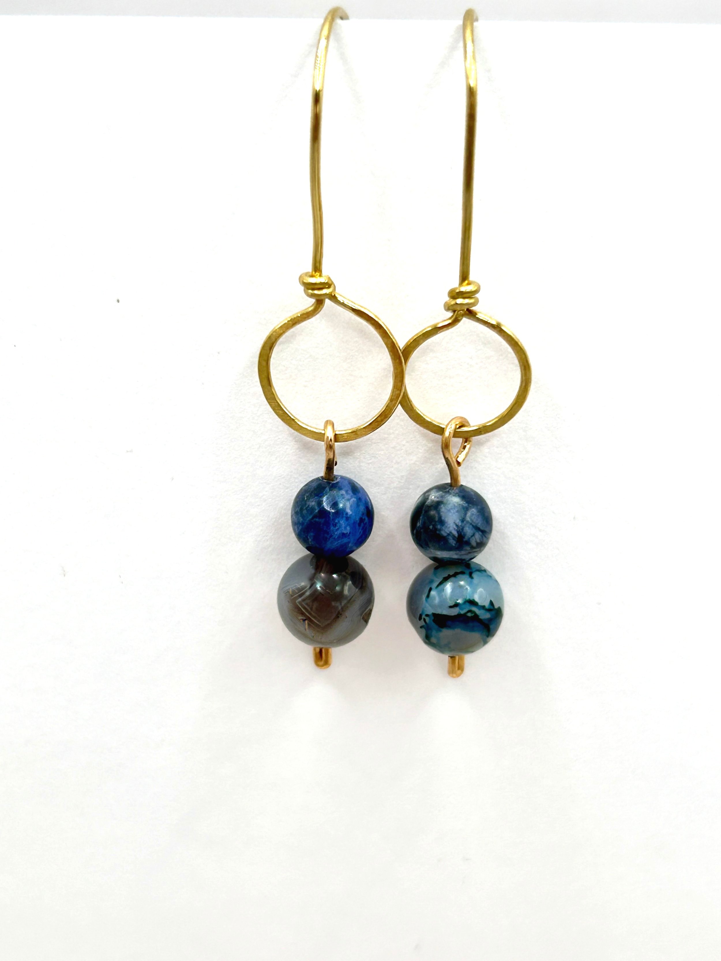 Open Horizon Circle Jeweler's Brass Metal with Blue Lapis Lazuli and Botswana Agate beads on a Drop Earring with Jeweler's Brass ear wires on white background