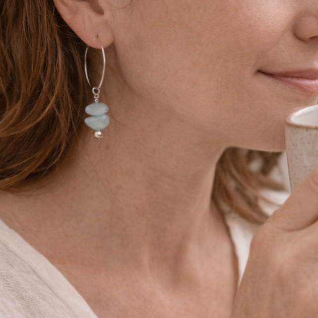 Aquamarine stones on silver hoop earrings