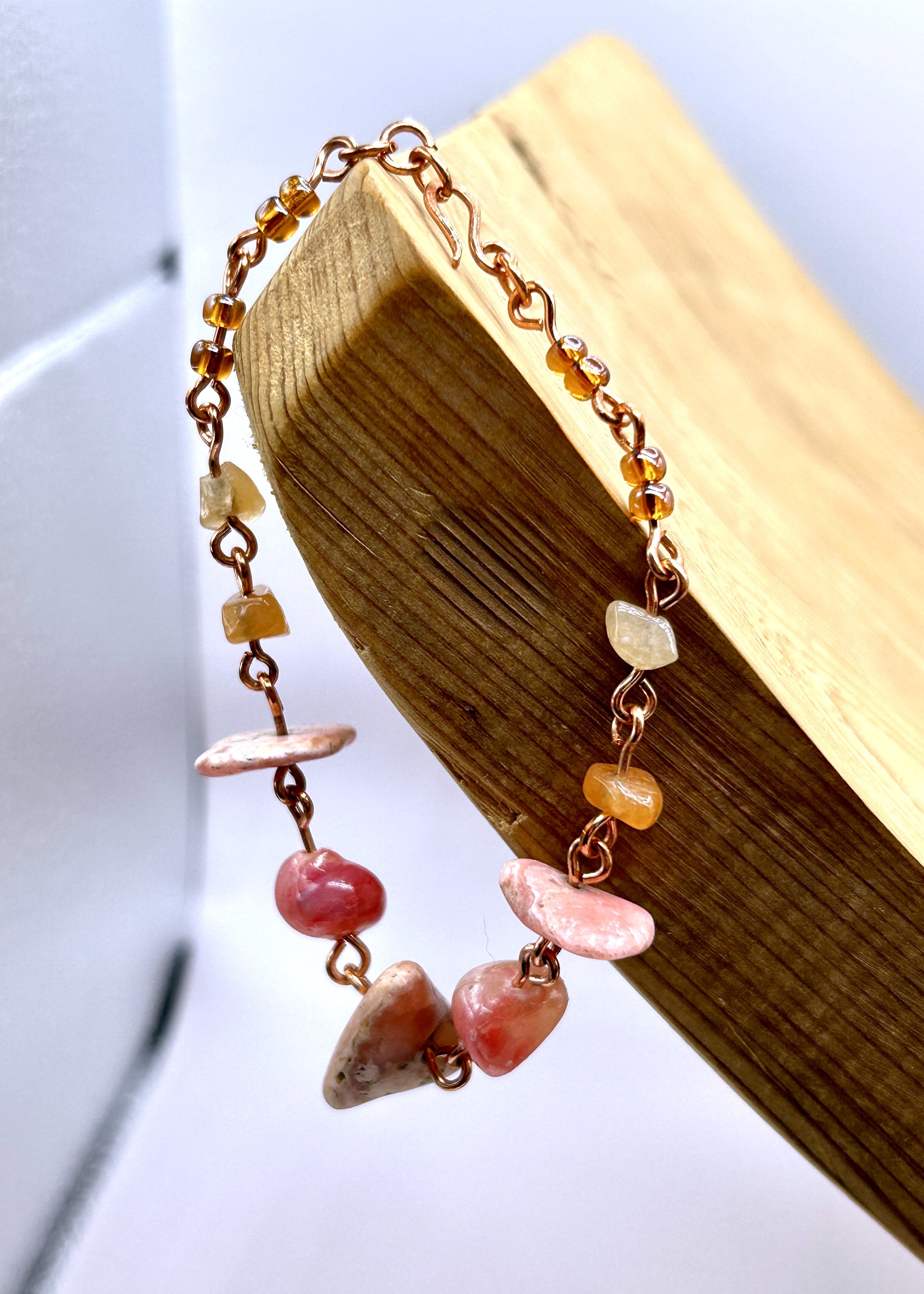 Barranca Pink Rhodochrosite Nugget Bracelet draped on wood
