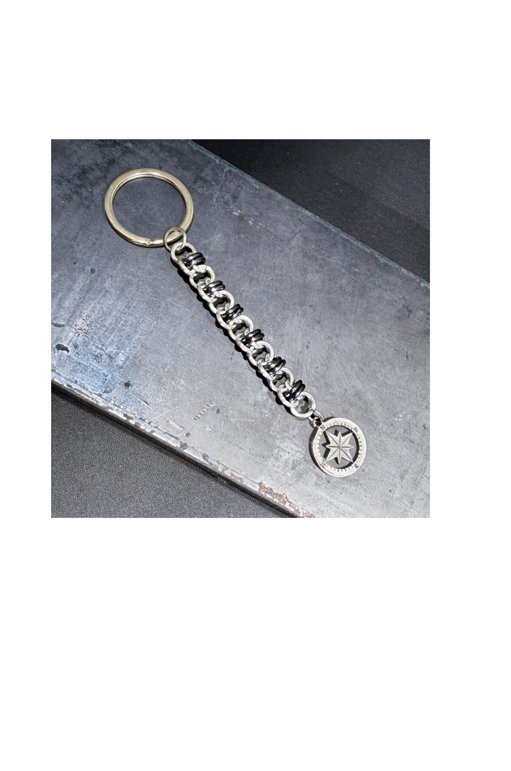 Keychain Basket Weave Compass metal background.jpg