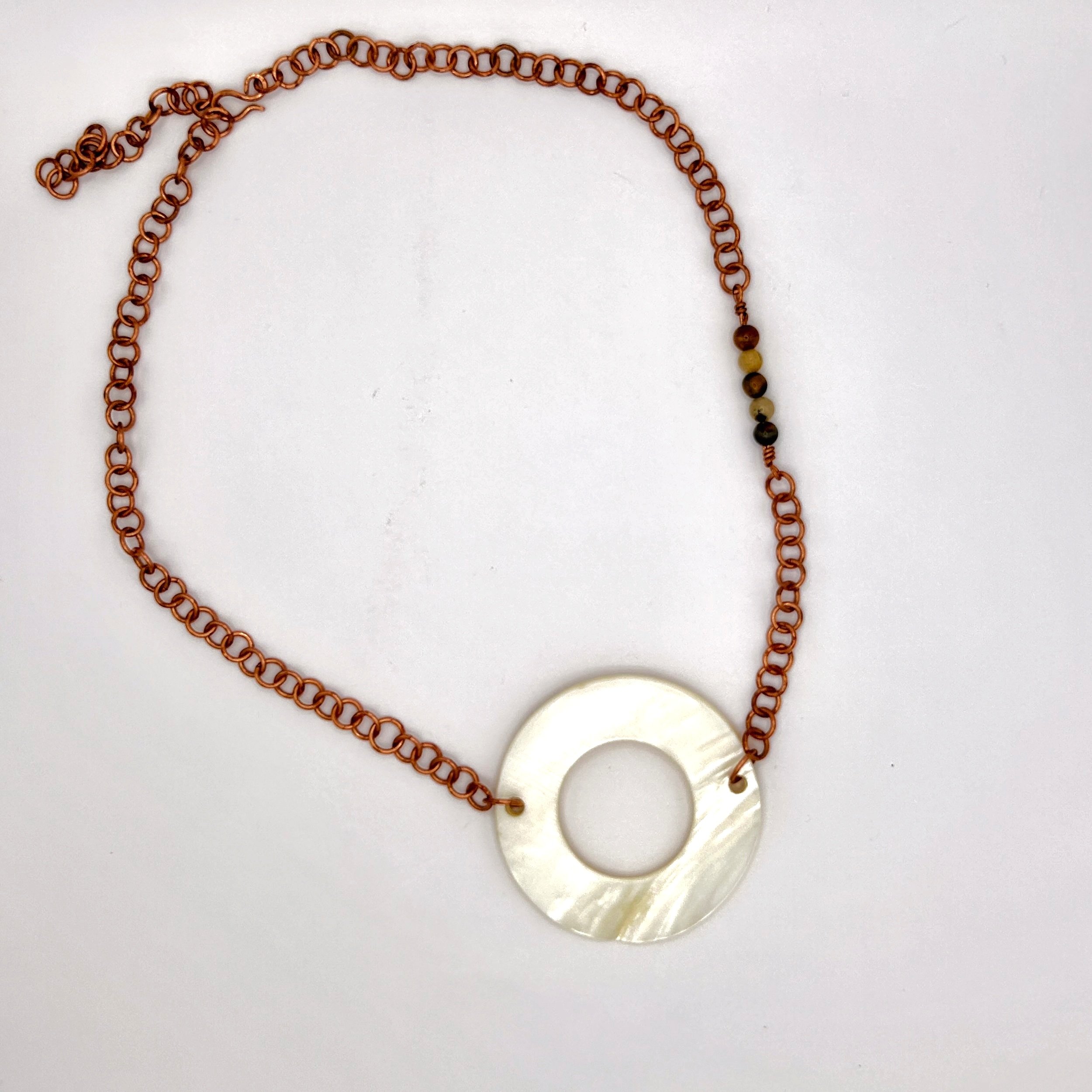 Abrial Donut Mother of Pearl on Copper Metal Link Necklace on white background