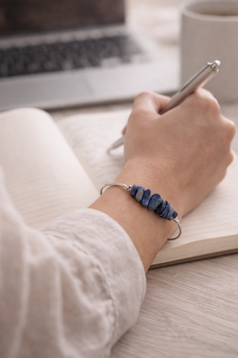 Lapis lazuli bangle bracelet at desk
