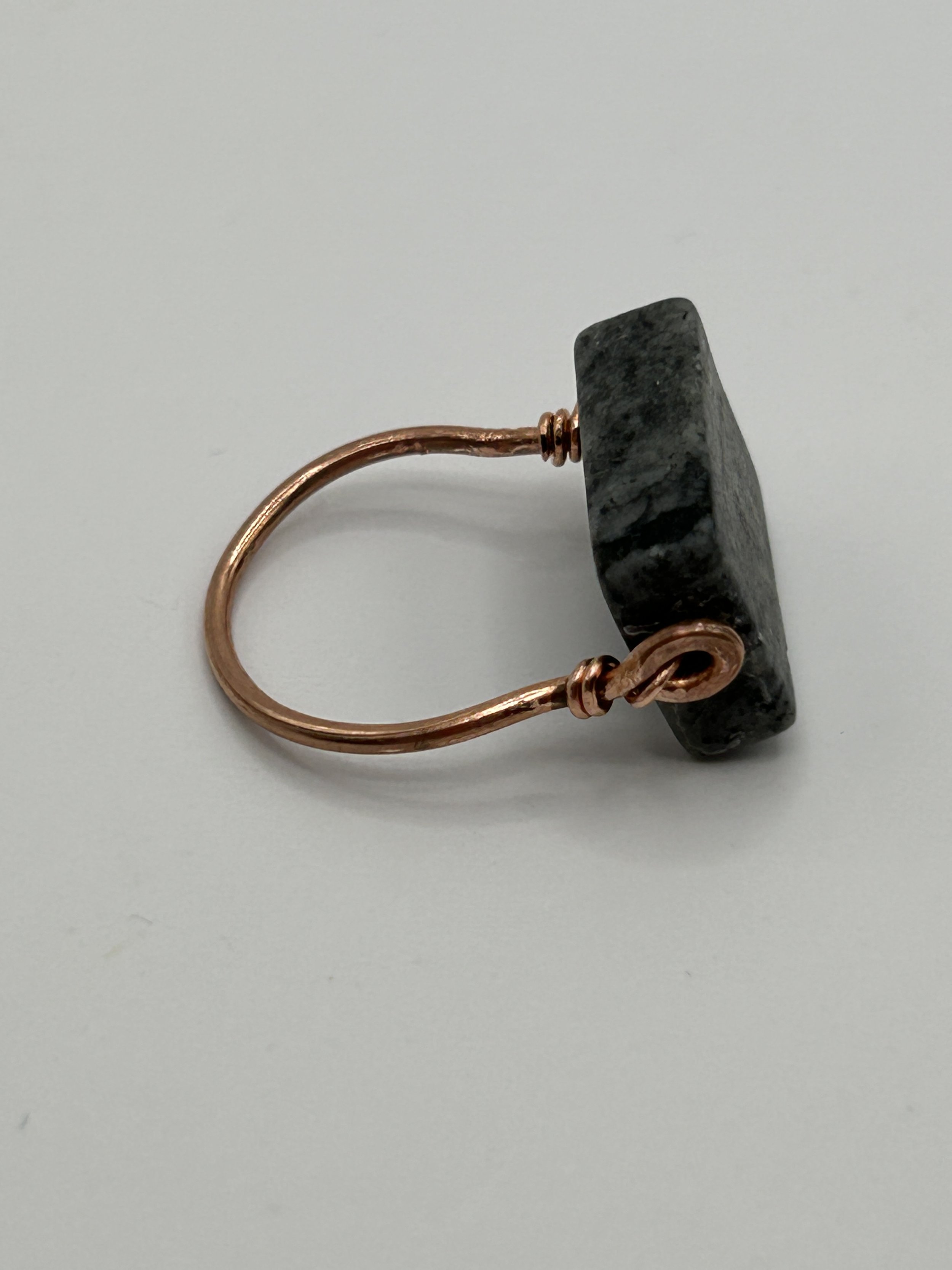 Gray Jungle Jasper rectangle stone on Copper Metal Ring on white background side view