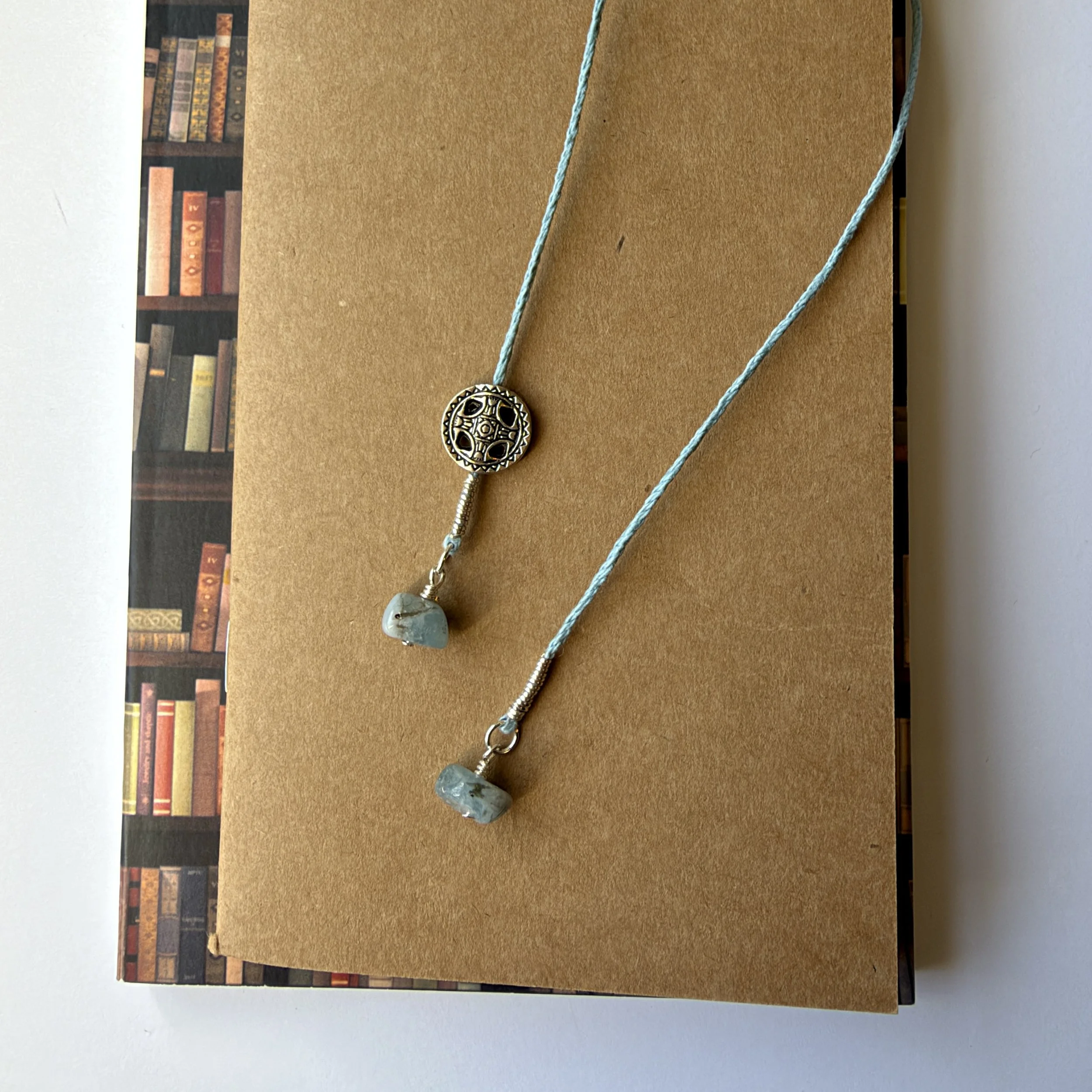 Light blue hemp cord and aquamarine bookmark with silver accents