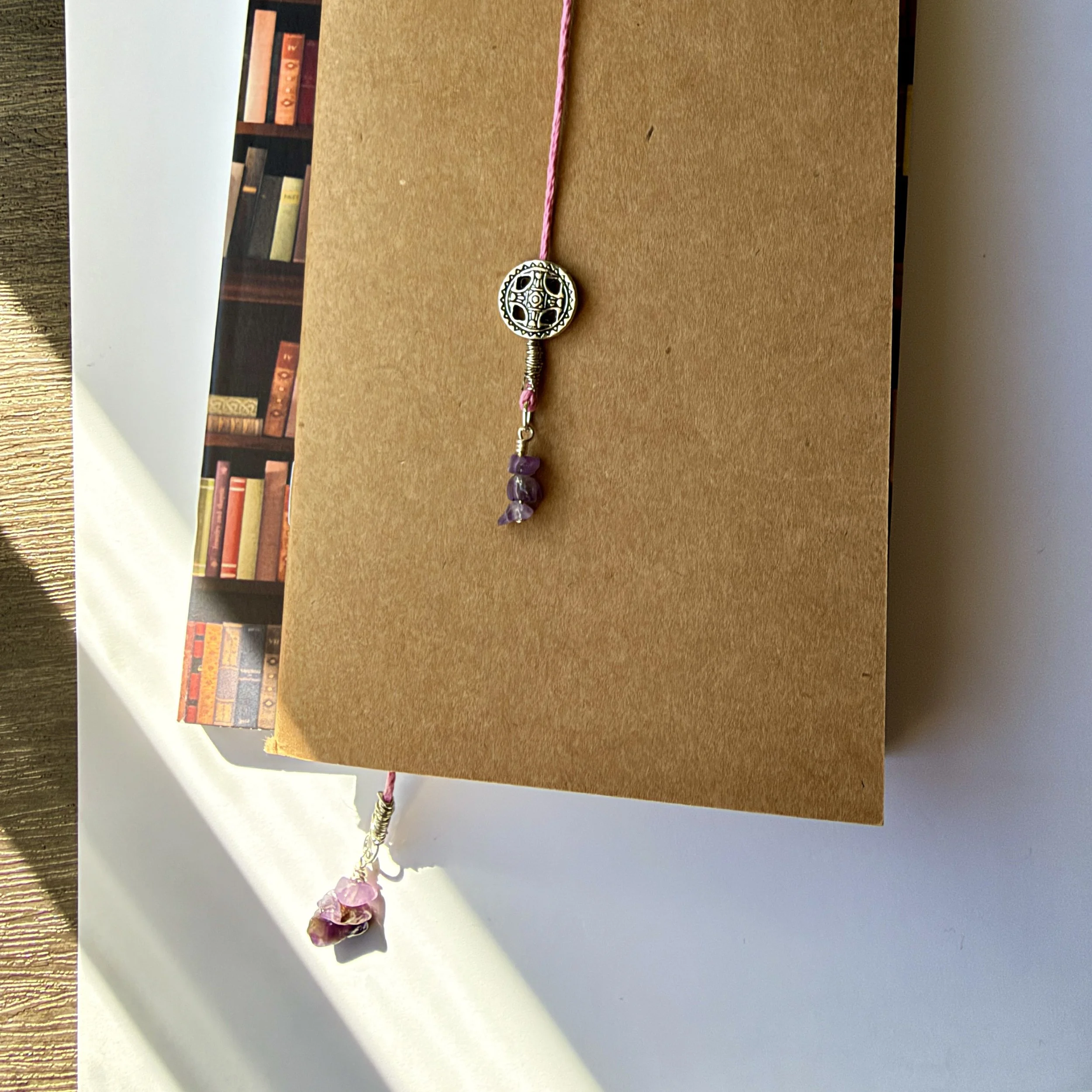 Light pink hemp cord and amethyst bookmark with silver accents
