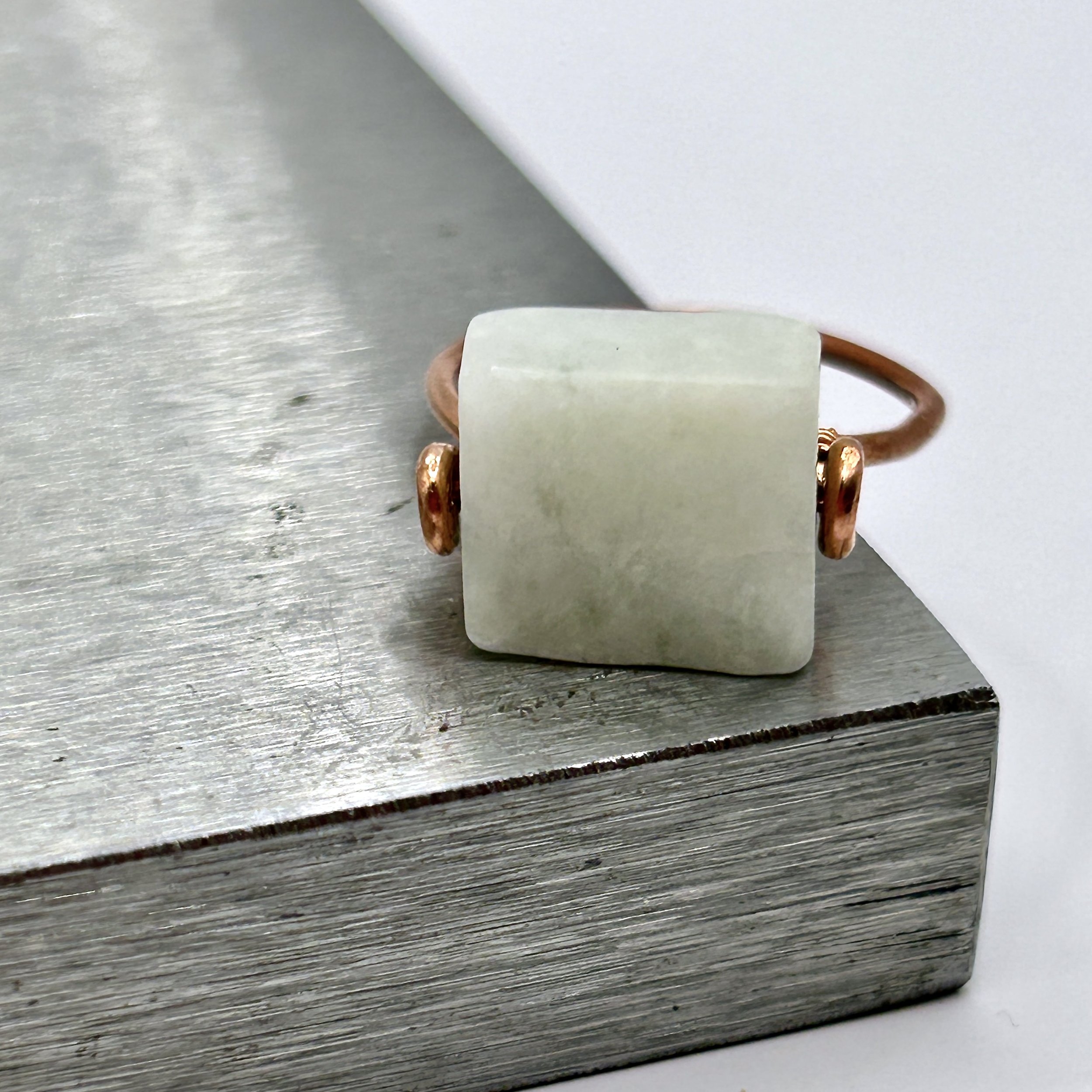 Sarsen Square Amazonite Stone and Copper Metal Ring on metal block front view