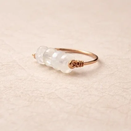 Rainbow Moonstone Bar Ring Pink Background