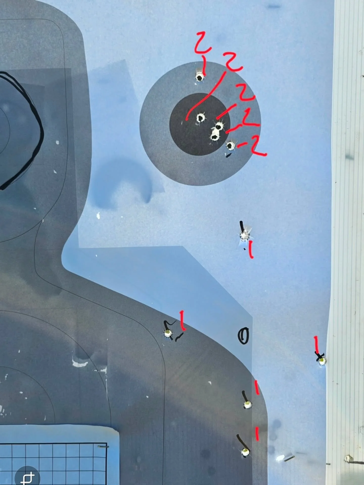 This was shot during a Pistol Mounted Optics class today. All shots were from 15 yards unsupported with the black circle being the point of aim. Shots marked with 1 were the first five shot &quot;group&quot;. Shots marked 2 were the second five shot 