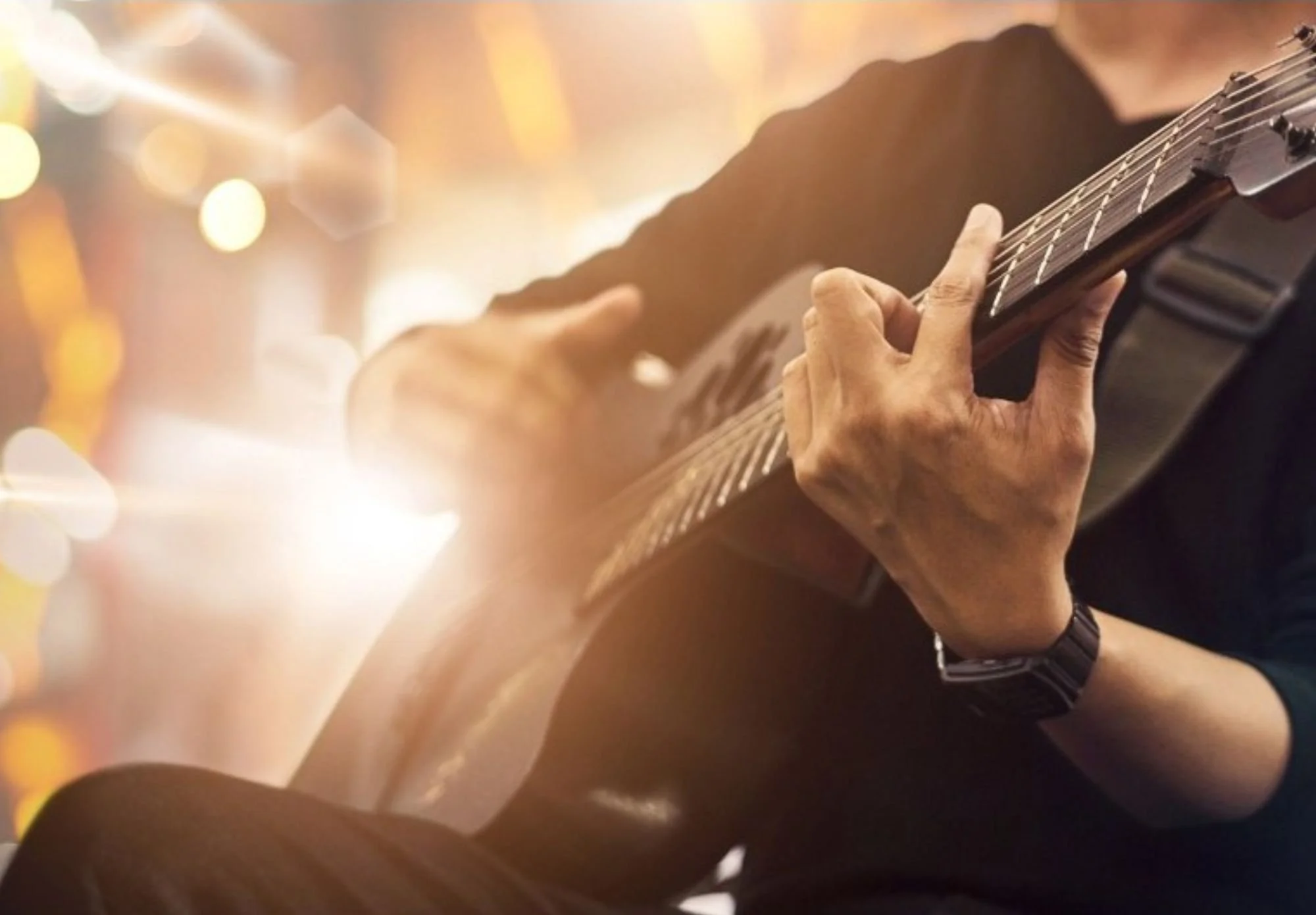 man playing a guitar