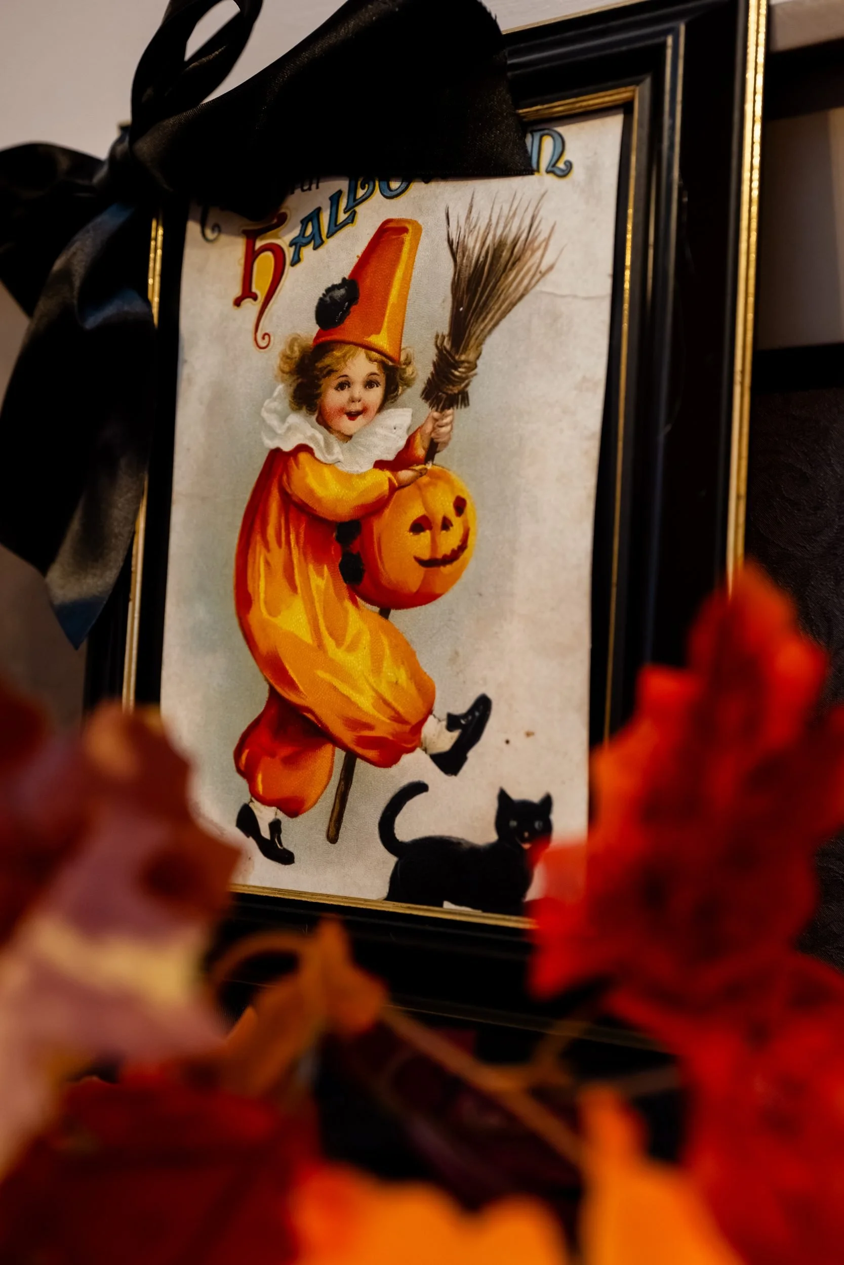 Framed vintage witch illustration at the reception