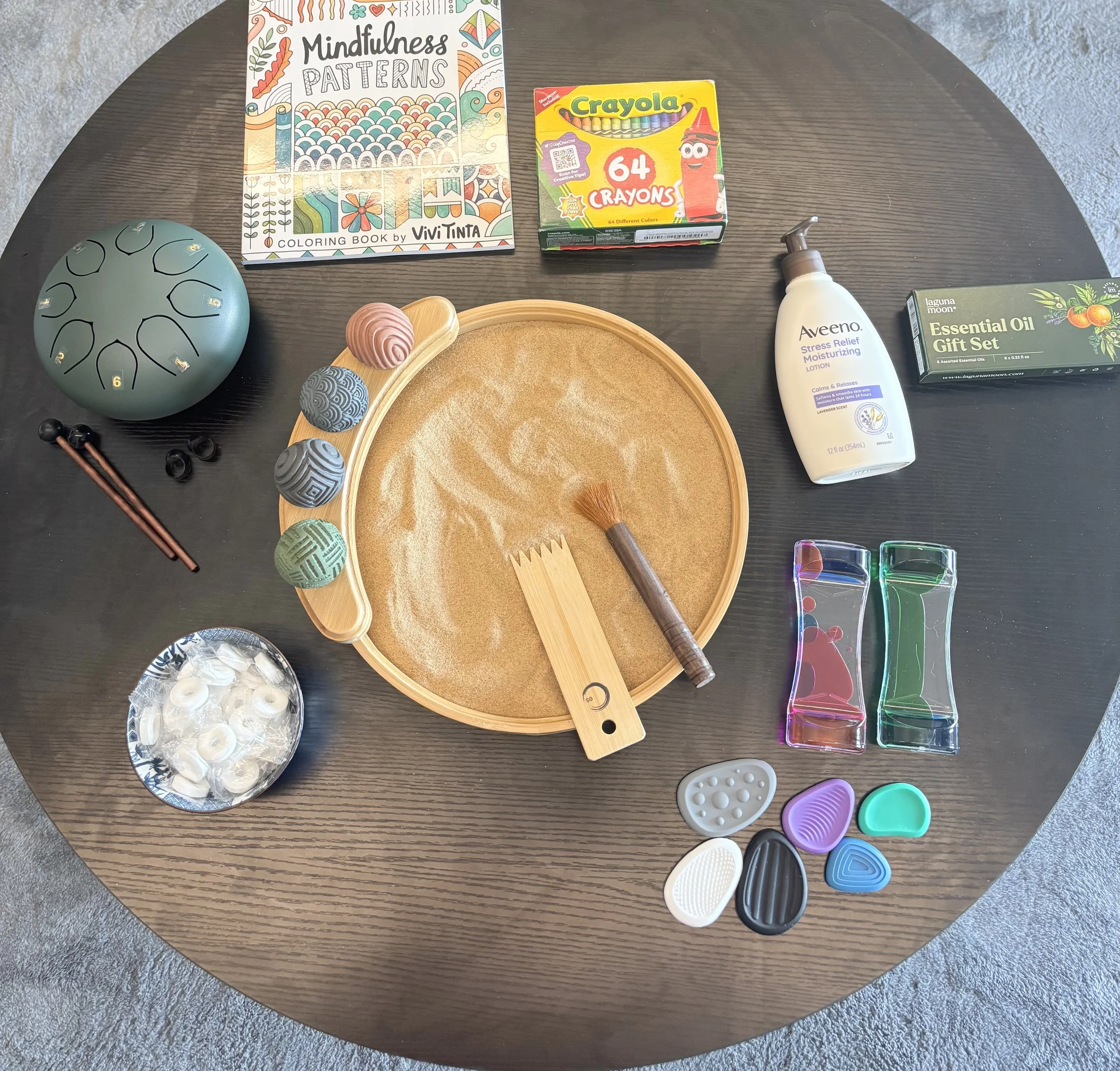 Mindfulness, holistic therapy tools (rain drum, sand tray, essential oils, coloring book, worry stones, liquid motion tools and mints)
