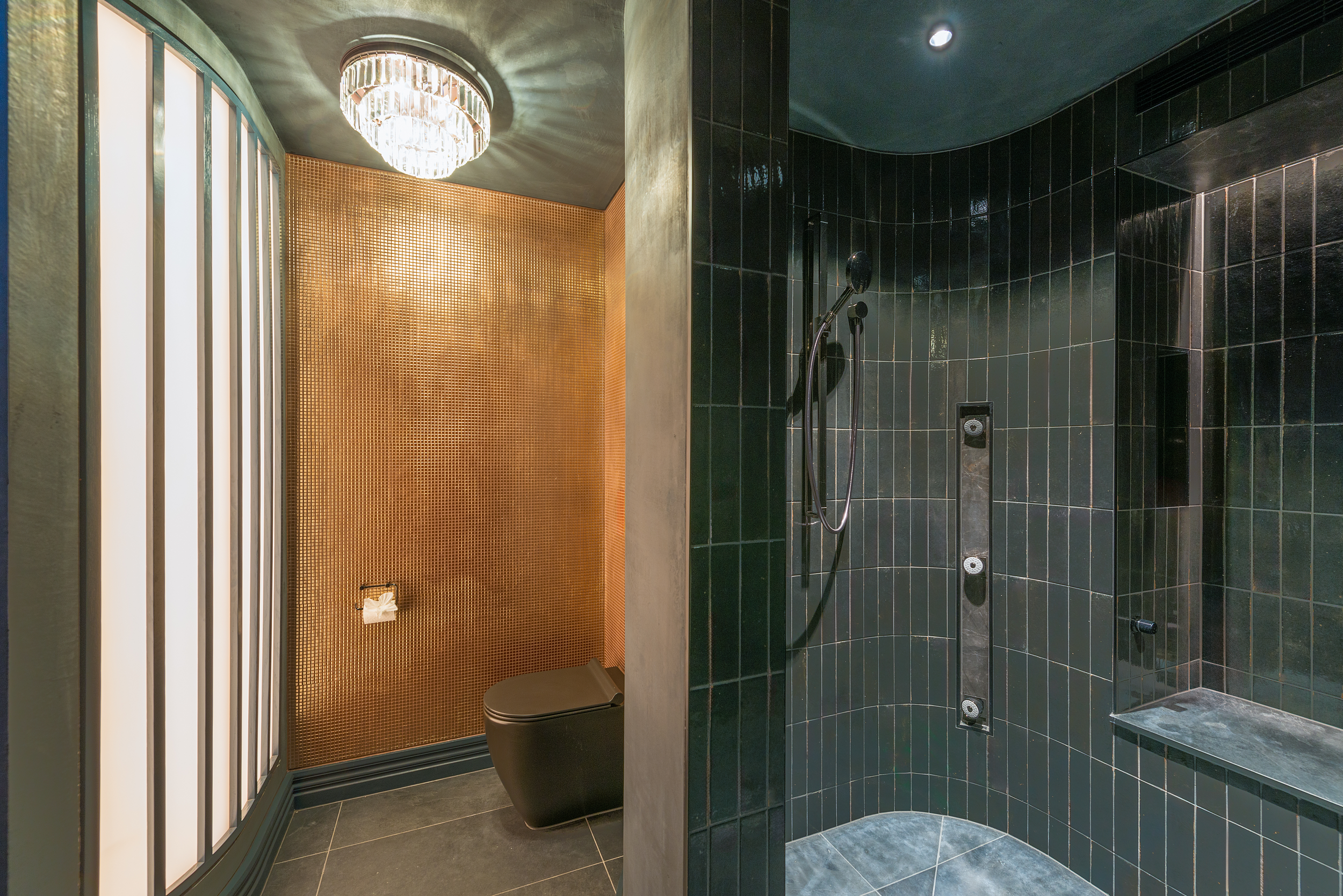Modern bathroom, curved wall shower and shower jets, featuring wall to wall feature tiling by Senna Developments in Lincoln, Canterbury