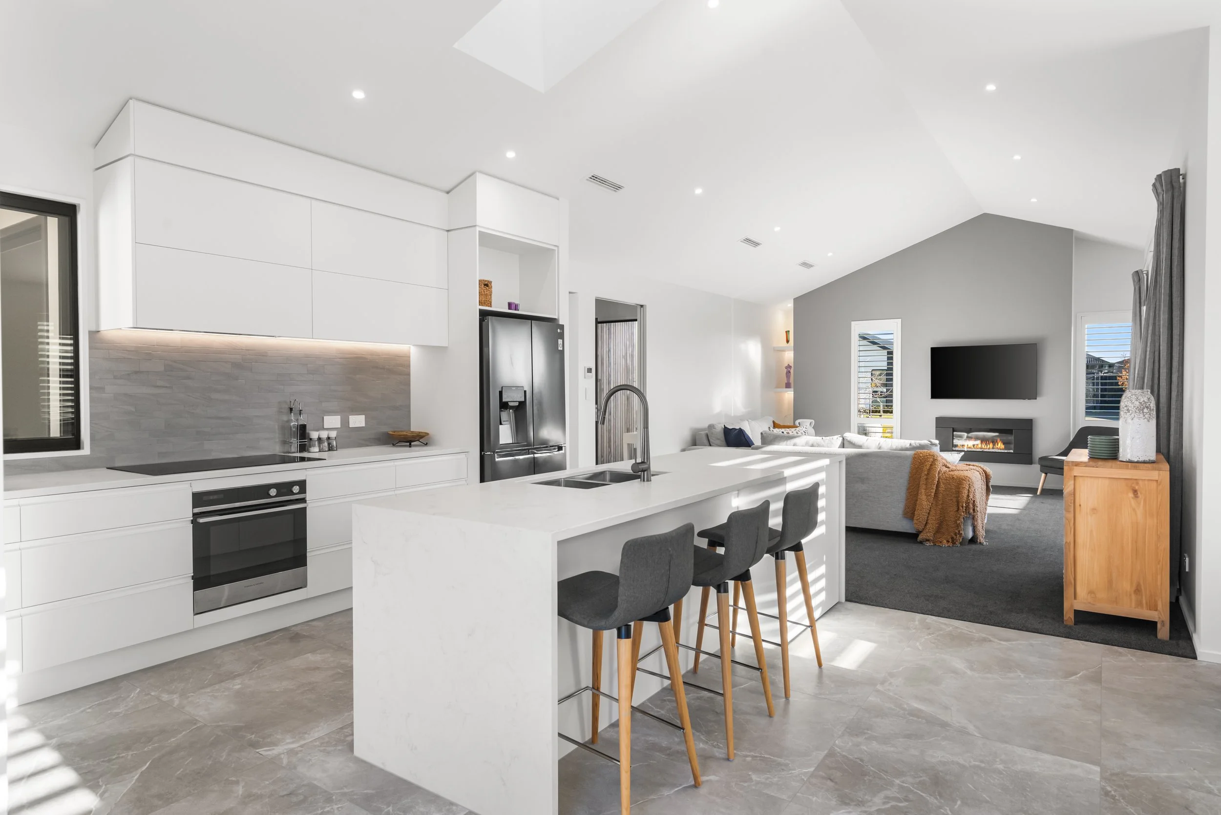 A modern, 4 bedroom home showcasing an open plan kitchen and Living room built by Senna Developments in Lincoln, Canterbury