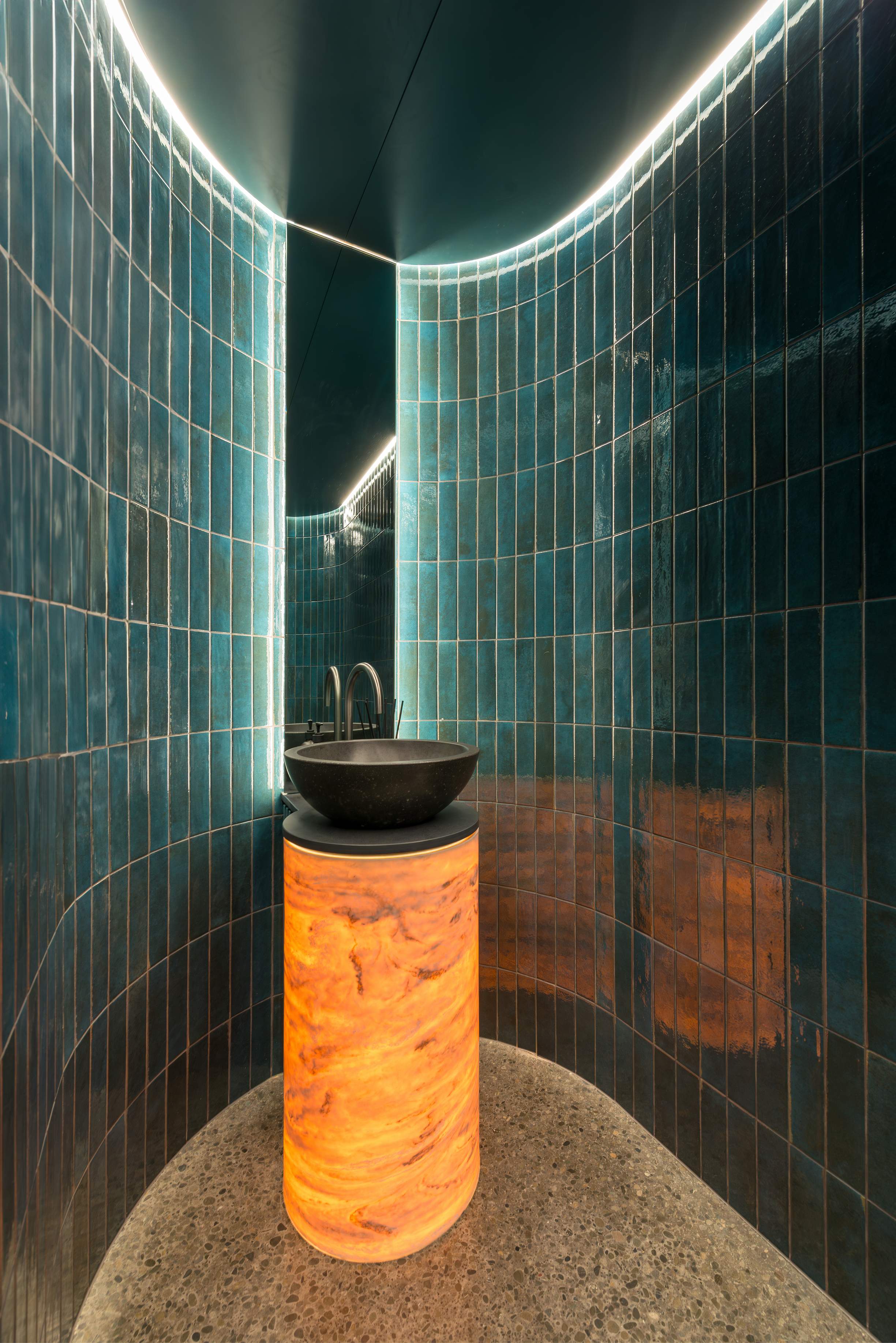 Luxury bathroom featuring curved blue tiled walls, designer, bespoke basin, concealed LED lighting and premium finishes in a custom architectural home by Senna Developments, Lincoln, Christchurch.