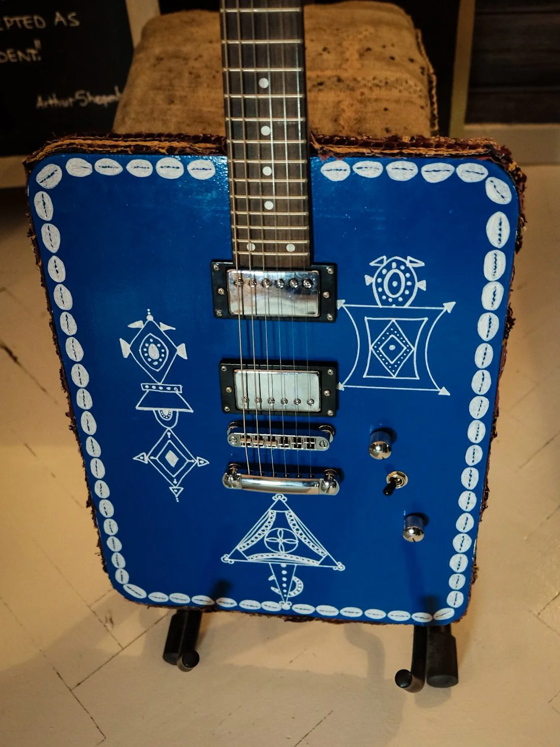Gembara — front view of the blue instrument and its decorative details.