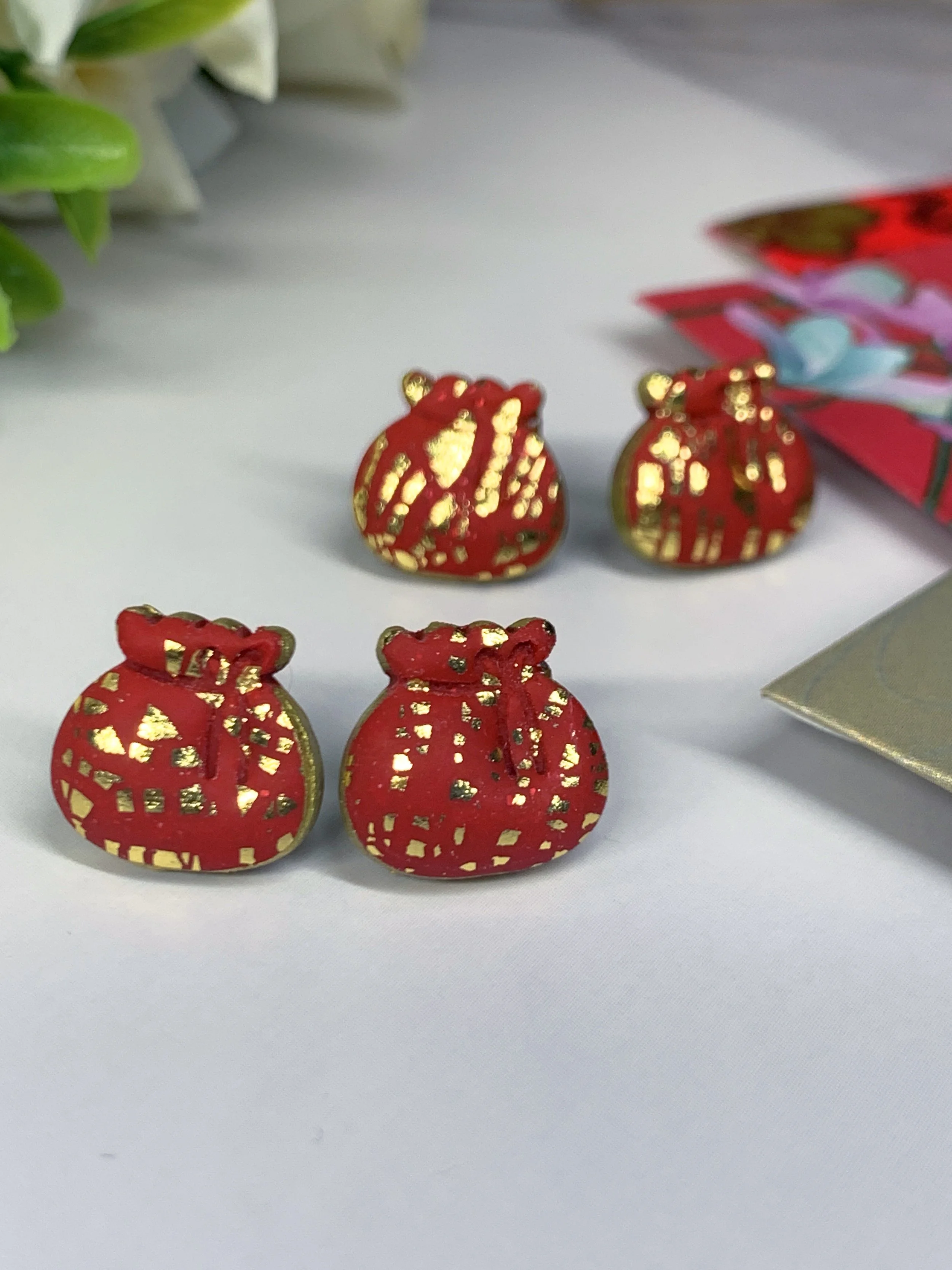 CNY Red and gold puffy fortune bags ear studs and clip-ons