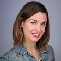 A woman in a white blouse and gray pants sitting on an orange chair against a multicolored geometric patterned wall, with a testimonial text box overlayed that says she is kind, compassionate, and sees things for what they truly are.