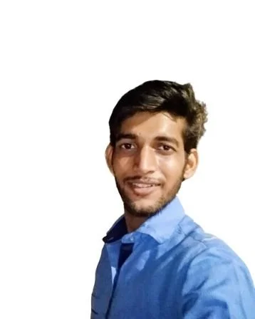 A man in a blue shirt smiling against a plain white background.