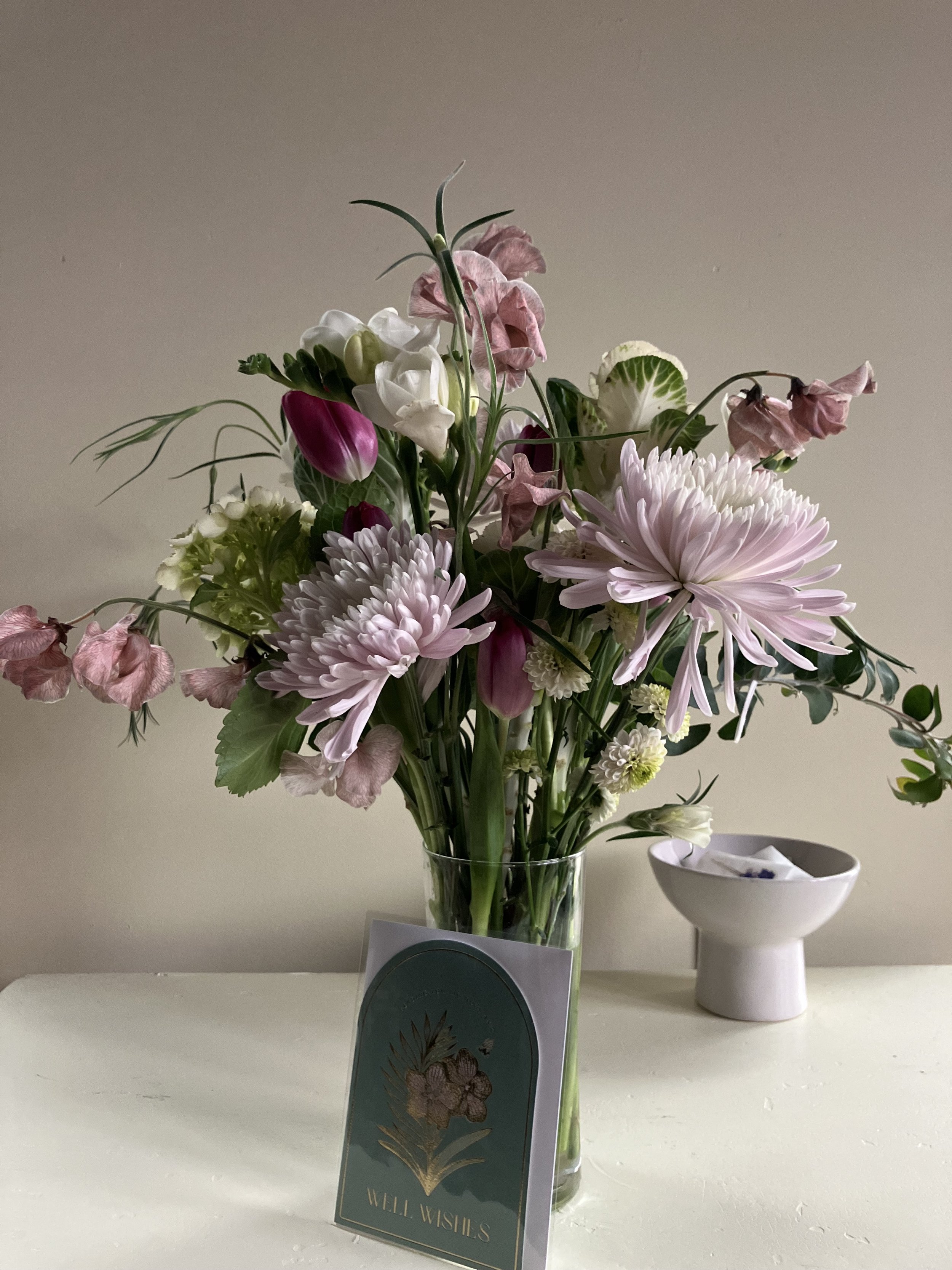 Freesia, chrysanthemum, sweat peas & kale with greenery