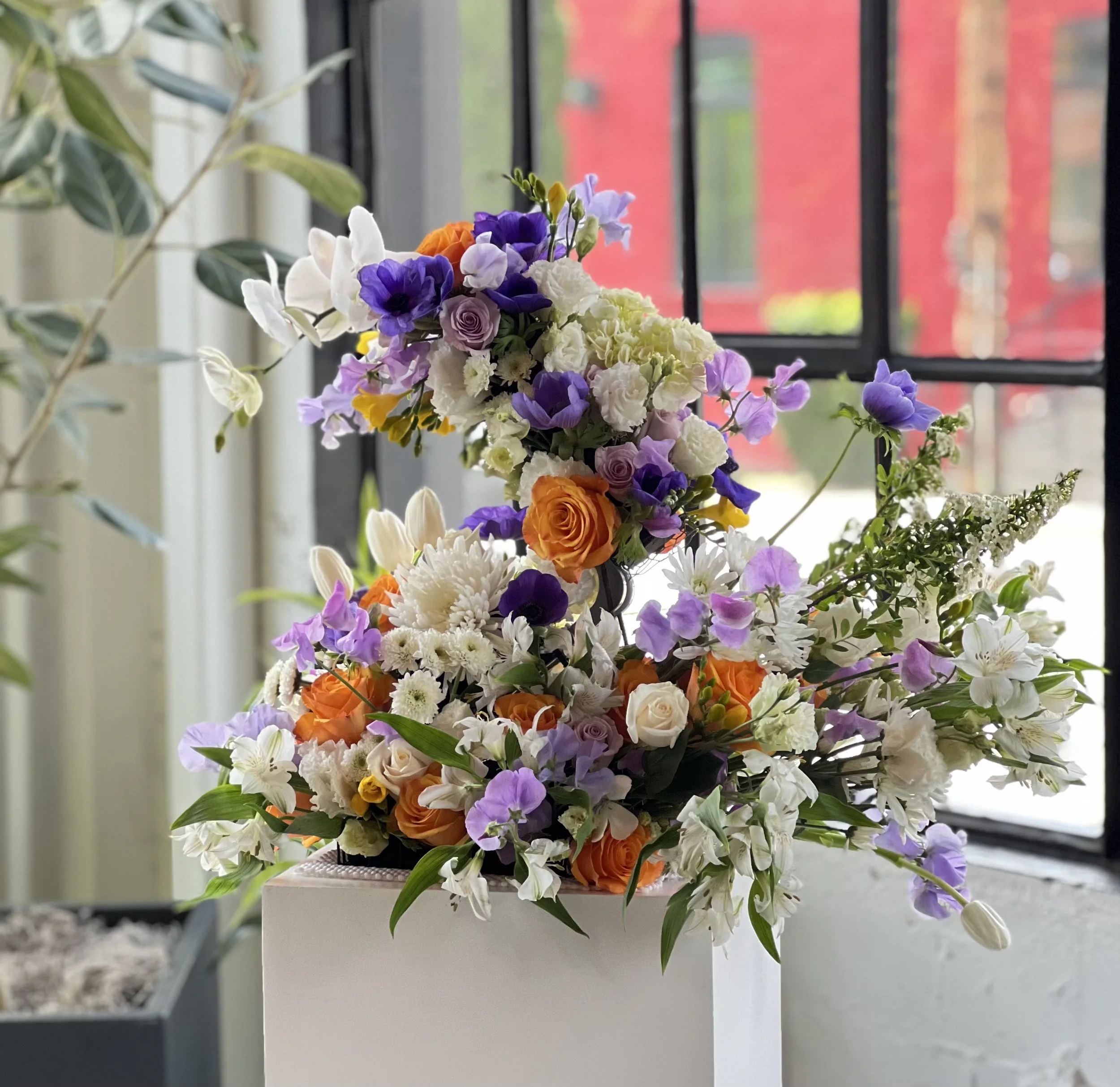 Wedding florals for a Portland wedding held at Castaway, using sweet pea, roses, anemone, lisianthus and other fresh blooms
