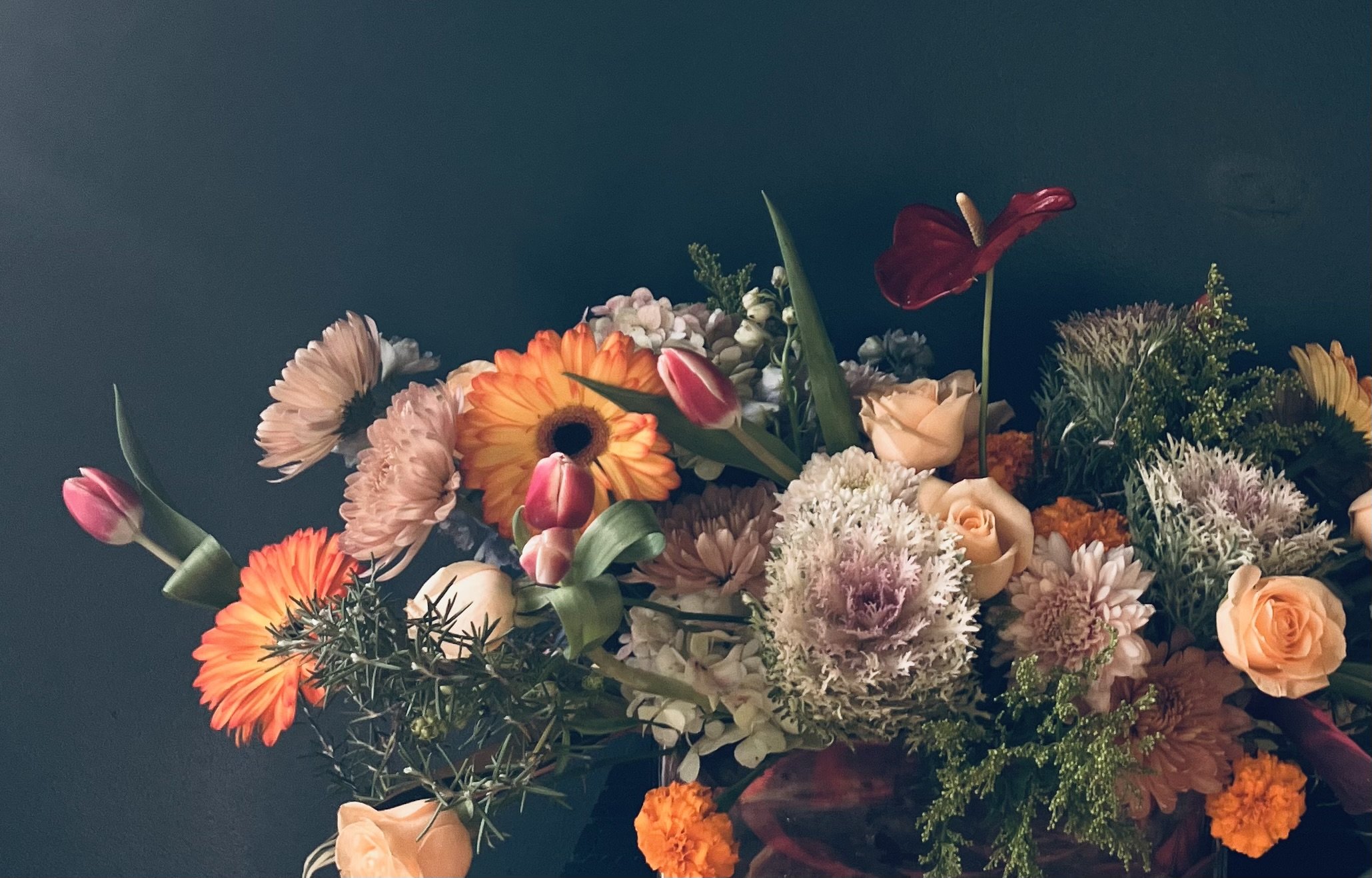 Fall season, garden-style arrangement in Portland, OR, with kale, daisies, and roses highlighted