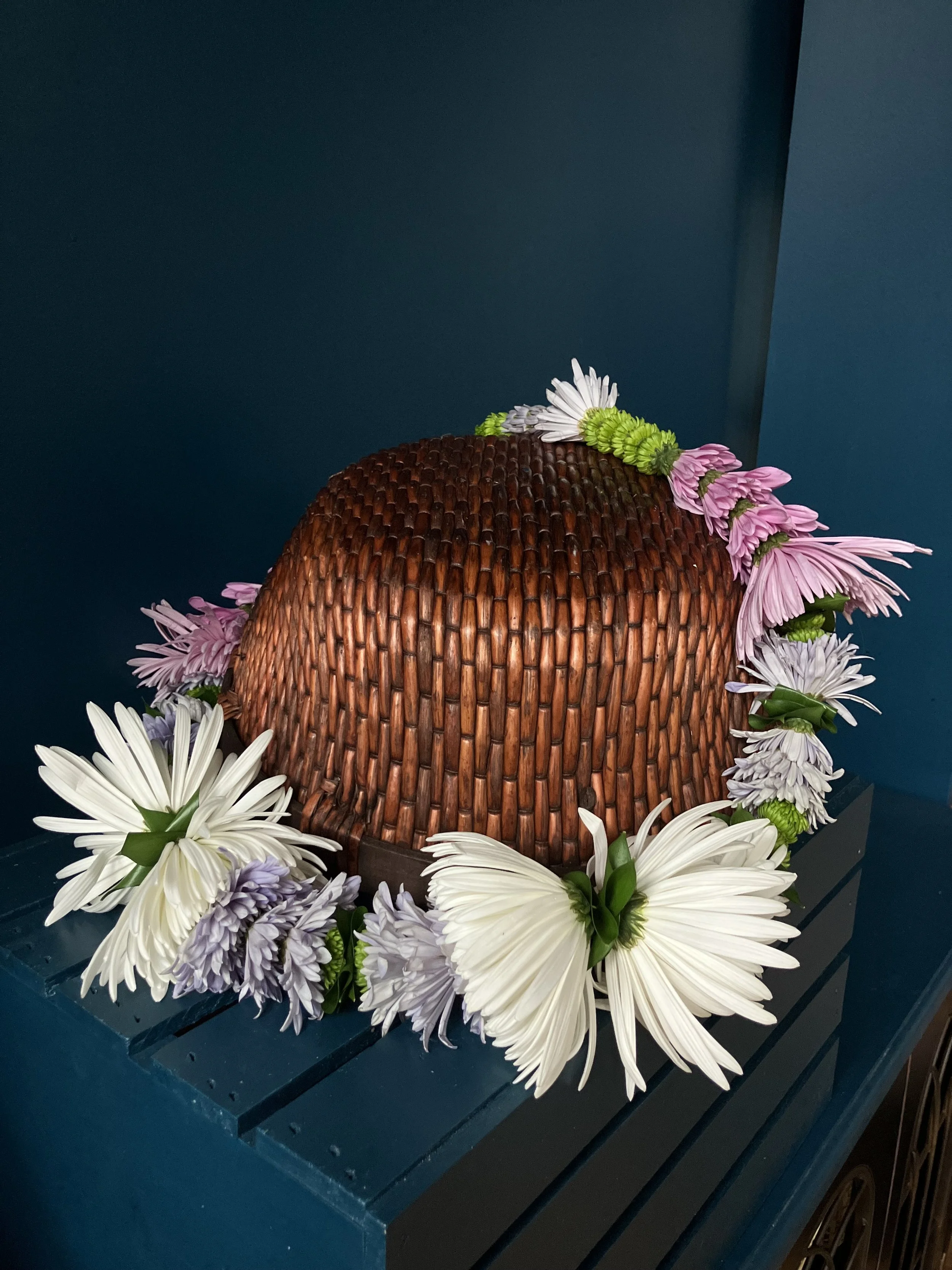 A specialty lei in pinks, purples and greens for someone's birthday