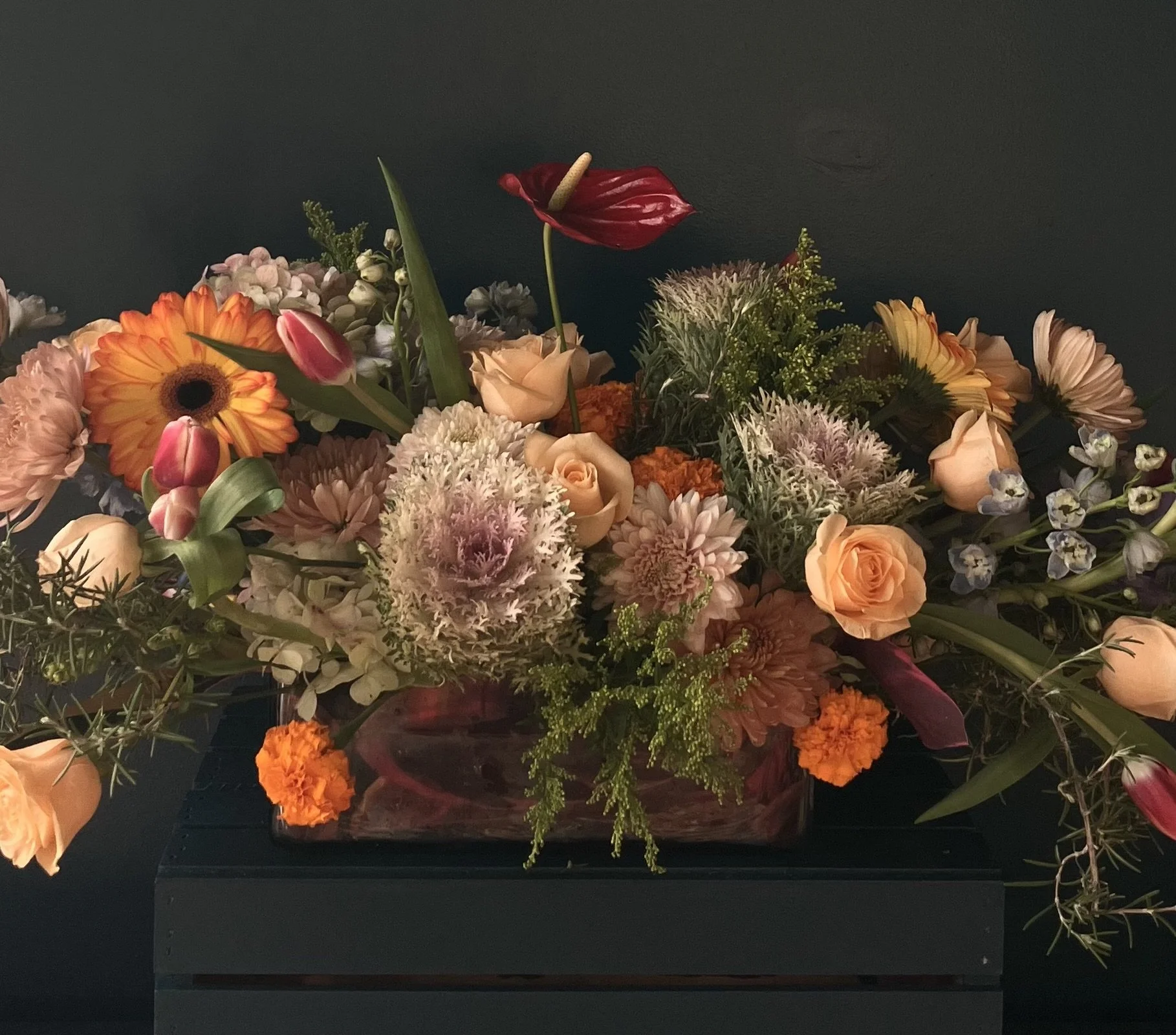 Garden-style floral centerpiece styled on a dining table by a Portland florist