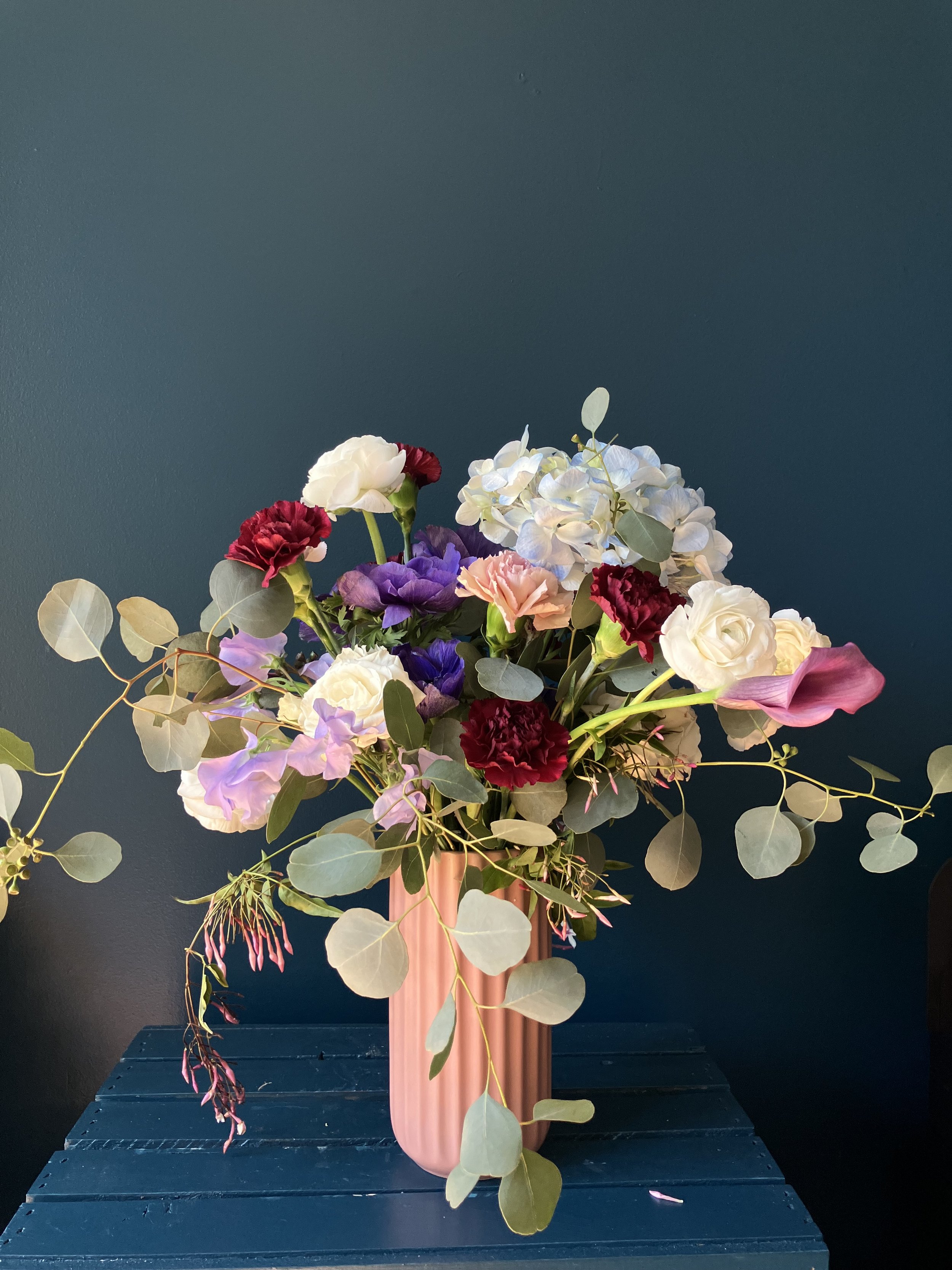 An arrangement created specially for all the mothers whose favorite colors are blue, purple and pink